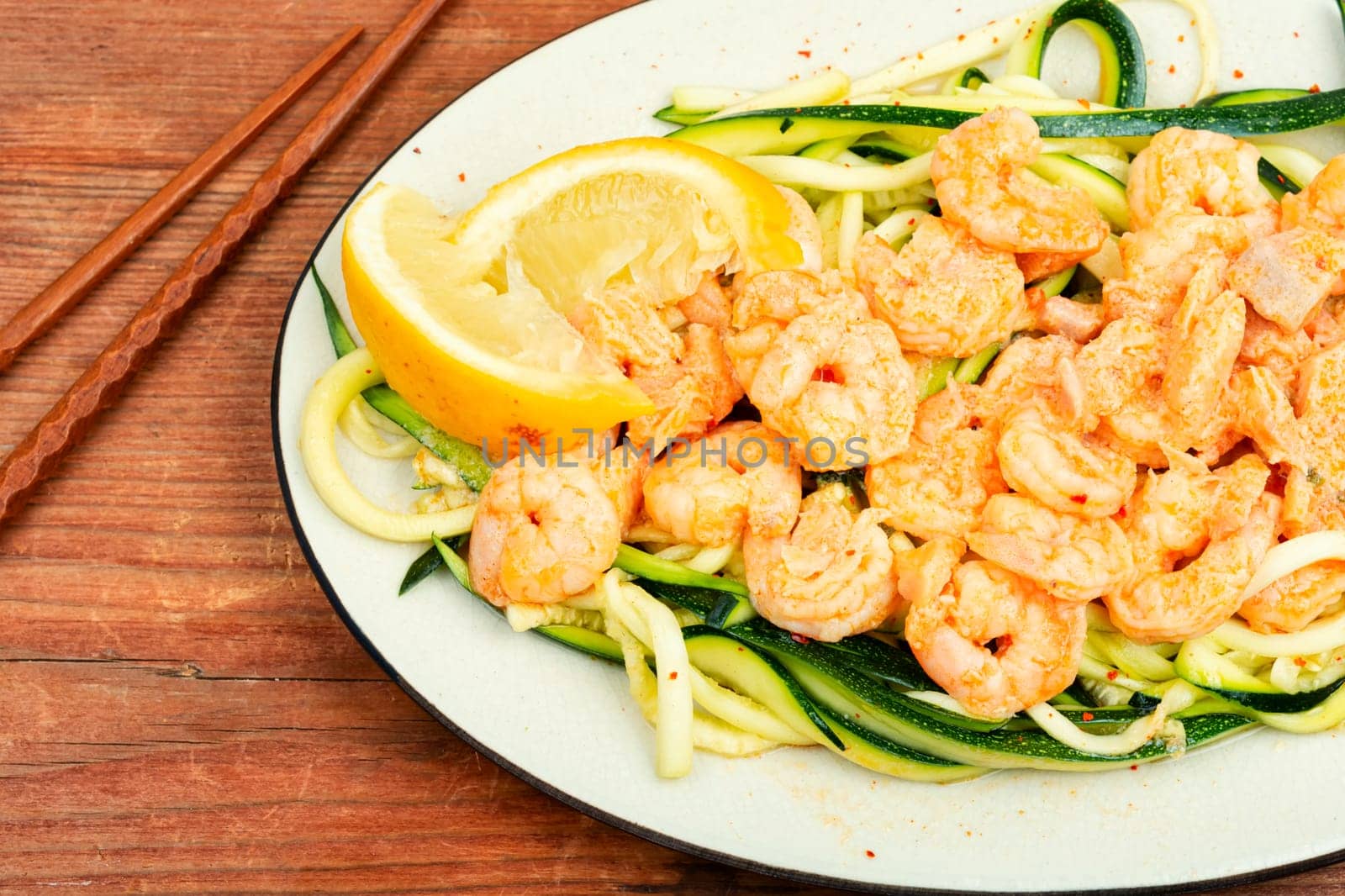 Stewed shrimps with sliced zucchini.