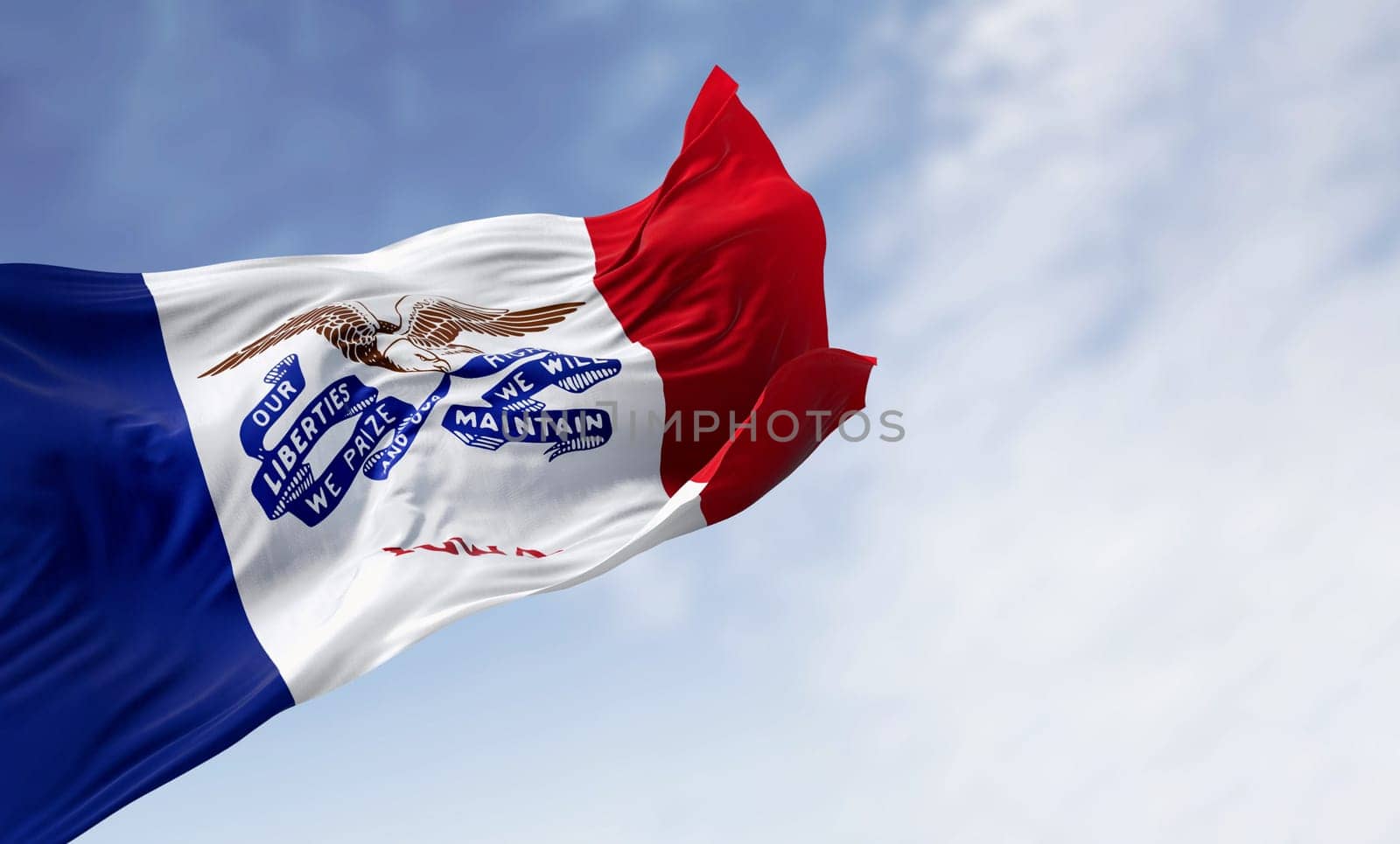 Iowa state flag waving in the wind on a clear day. Three vertical stripes of blue, white, and red, with a bald eagle in the center. 3d illustration render. Textured fabric background