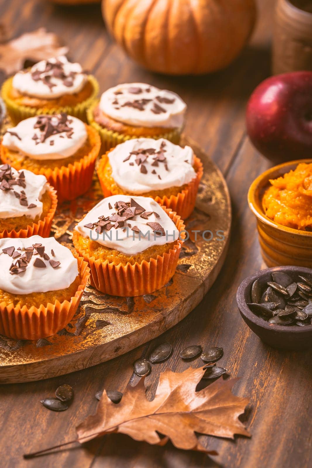 Spicy pumpkin muffins or cupcakes with cream cheese frosting