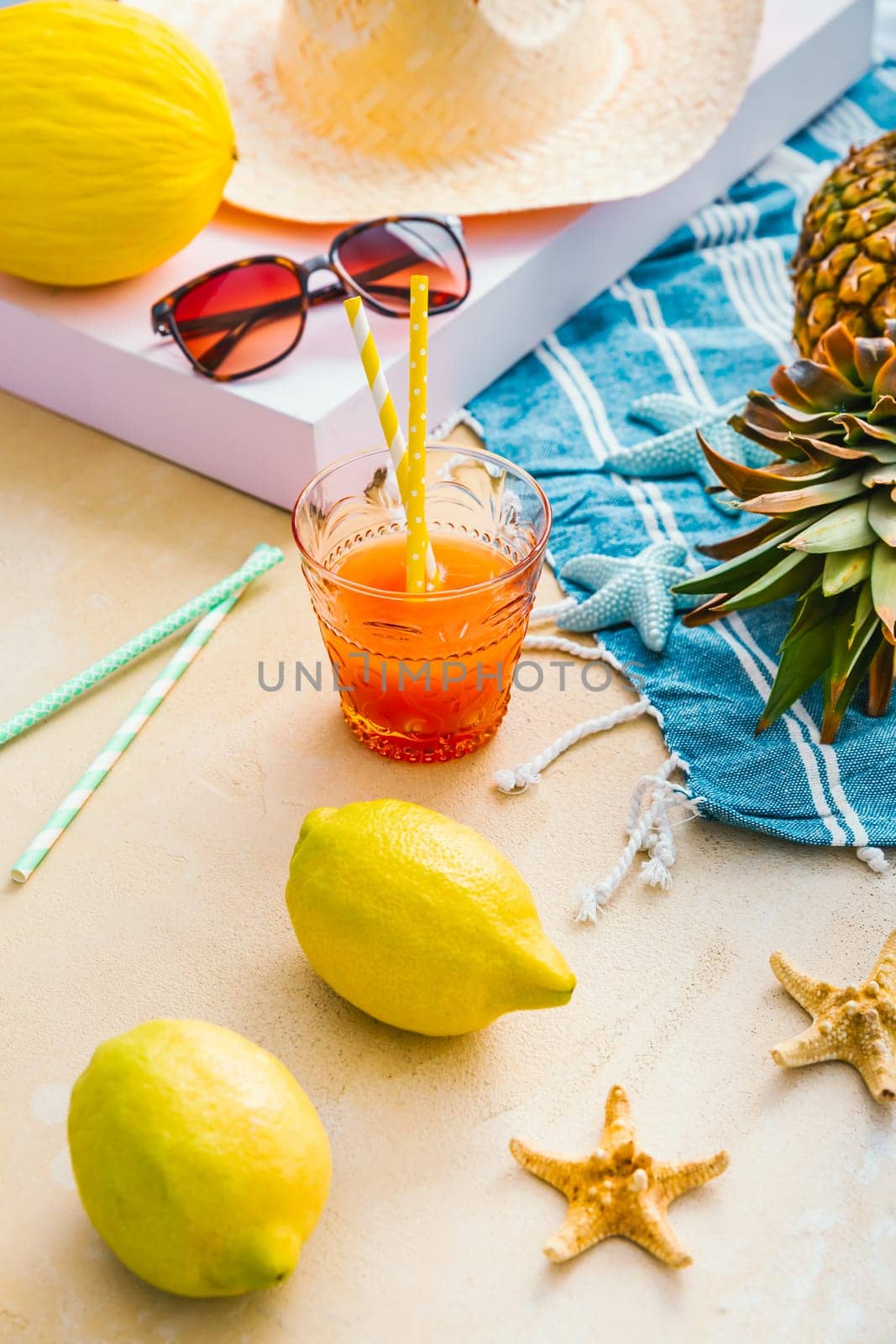 Summer holiday concept, summer accessories with refreshing juice and fresh fruits
