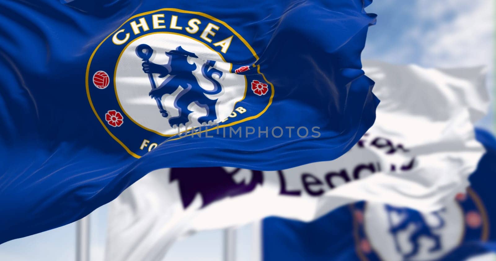 London, UK, July 12 2023: Chelsea Football Club and Premier League flags waving on a clear day. Rippled Fabric. Selective focus. Illustrative editorial 3d illustration render