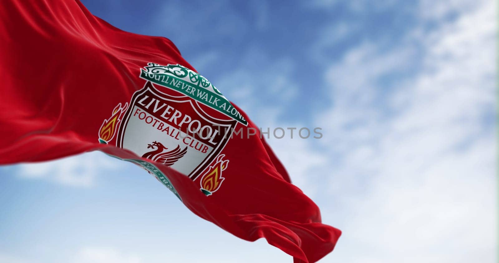 Liverpool, UK, Jube 30 2023: Liverpool Football Club flag waving on a clear day . Liverpool F.C. is an english professional football club. Illustrative editorial 3d illustration render