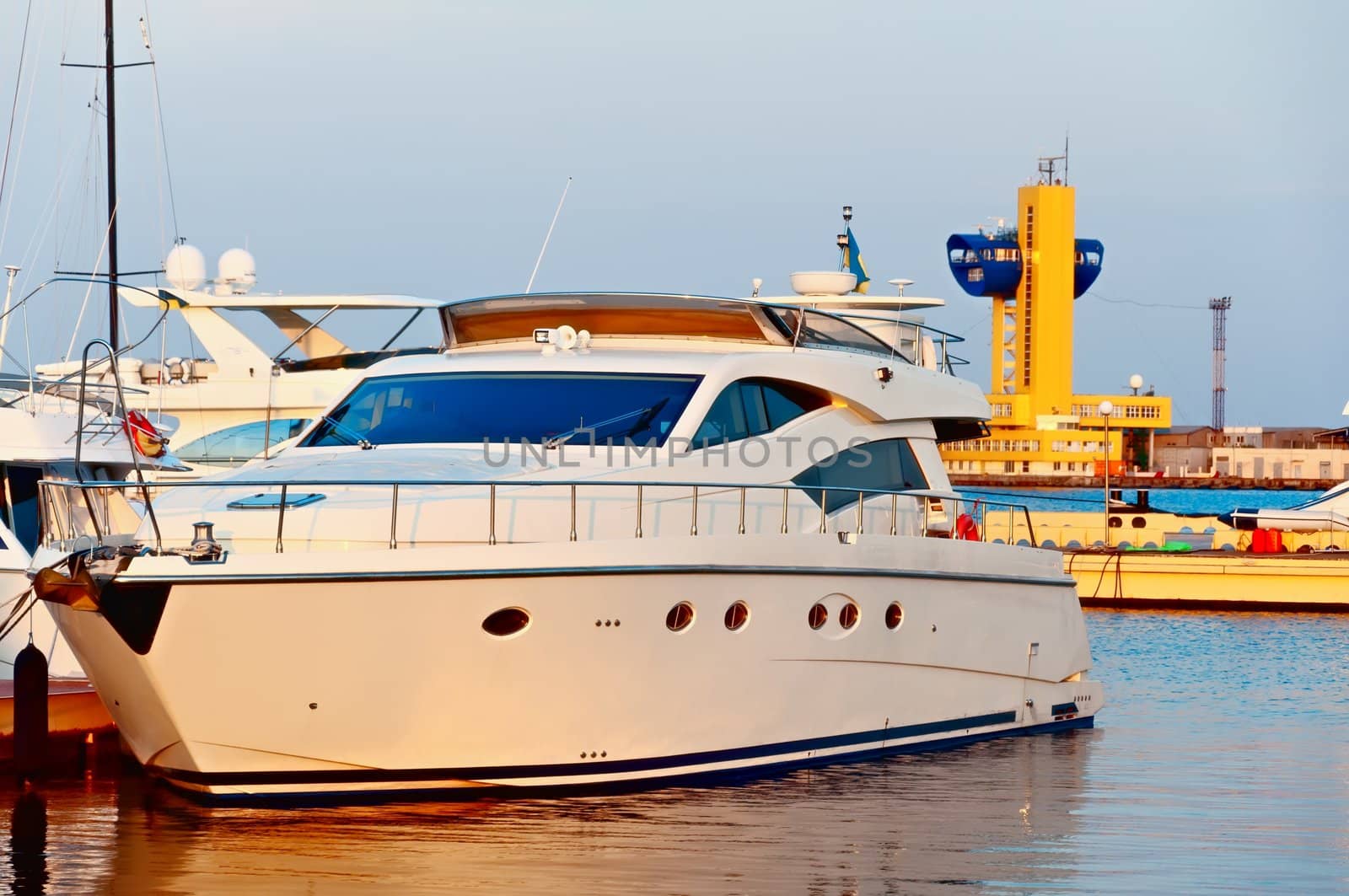 Motor Yacht at the mooring in port. Odessa. Ukraine. The picture is taken at sunset.