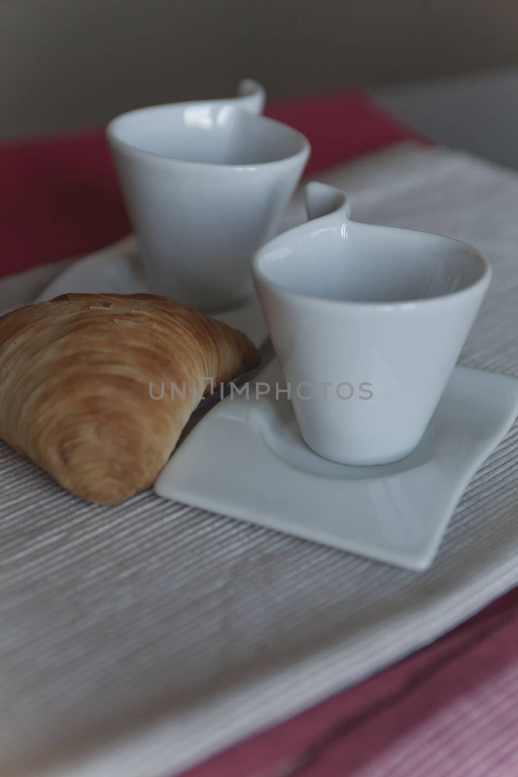 croissant and coffee cup at breakfast