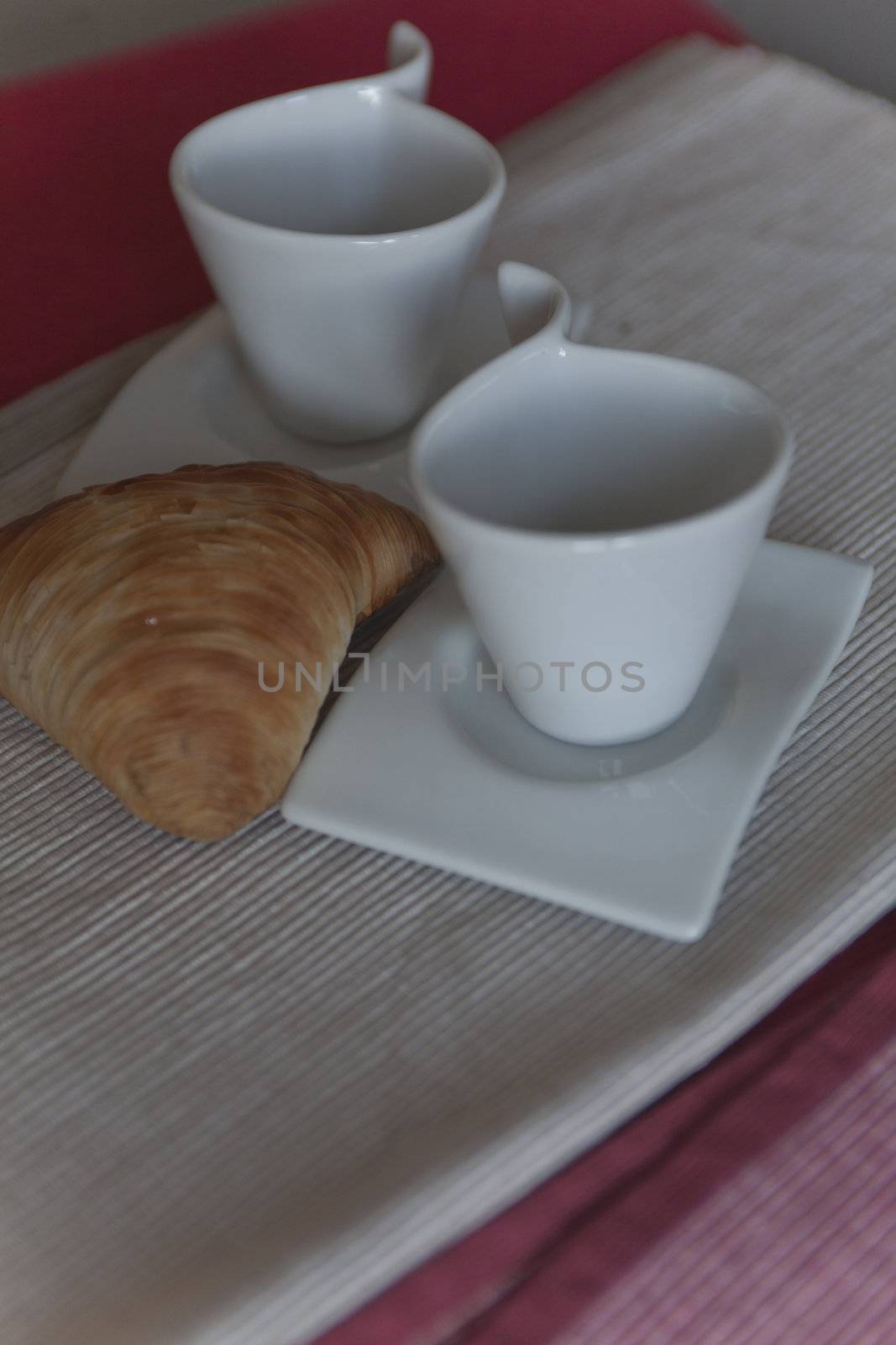 croissant and coffee cup at breakfast