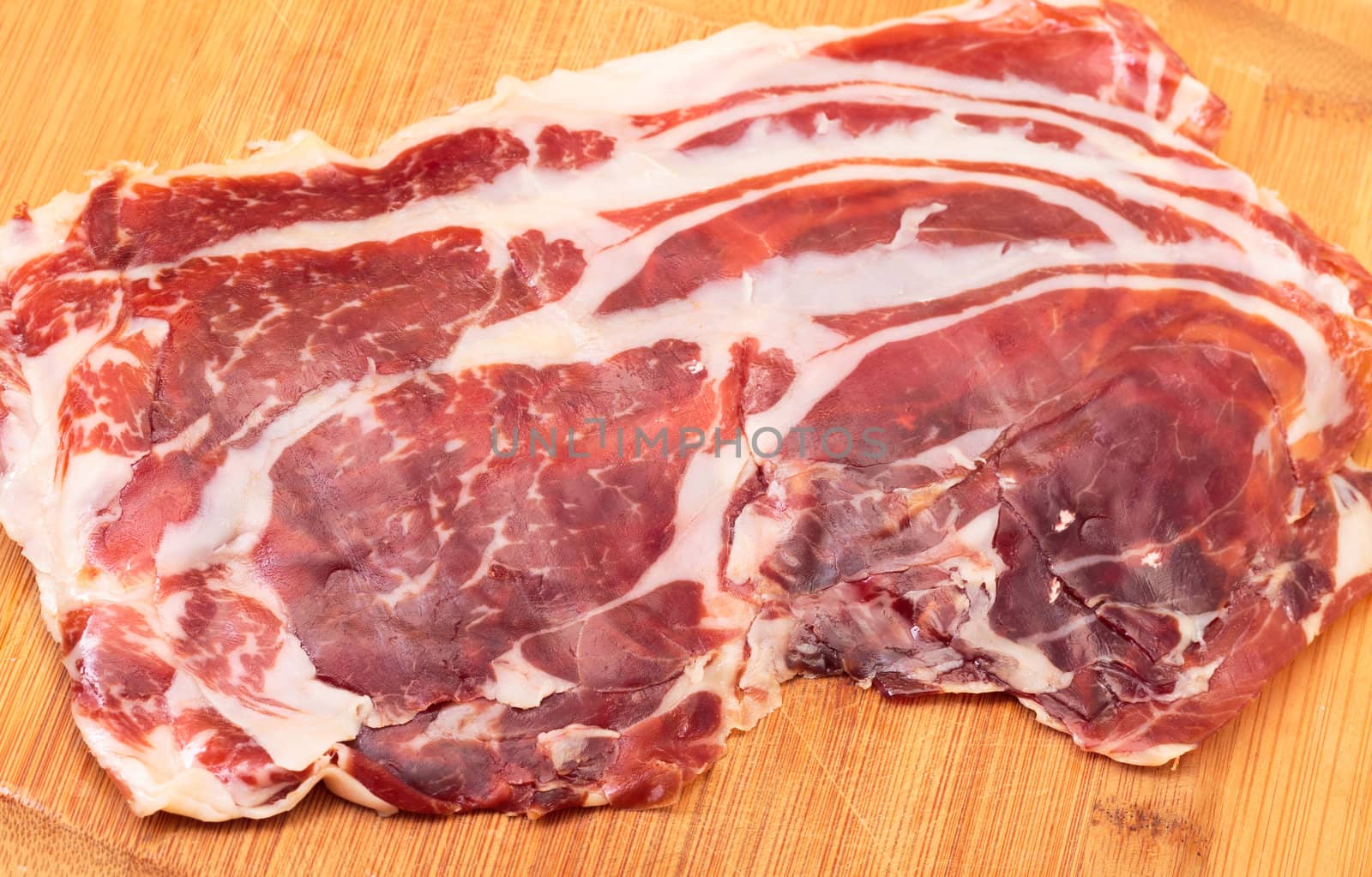 Thiny Sliced Spanish Jamon, on cutting board