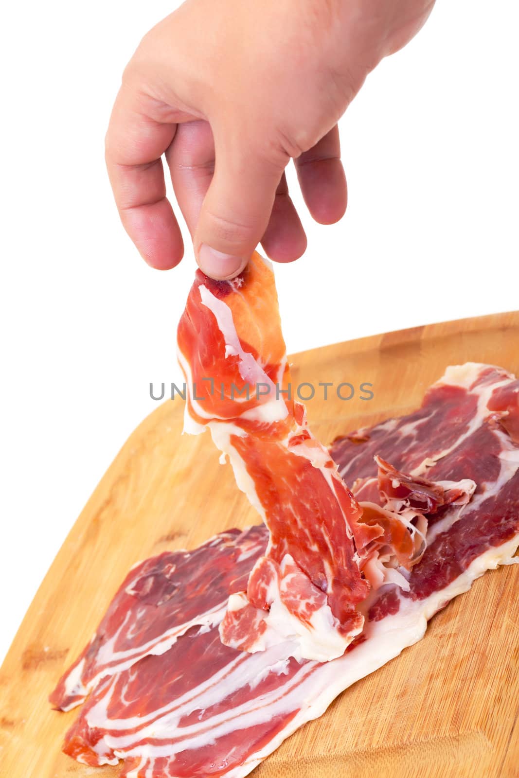 Thinly Sliced ​​Spanish Jamon with a Hand by Discovod