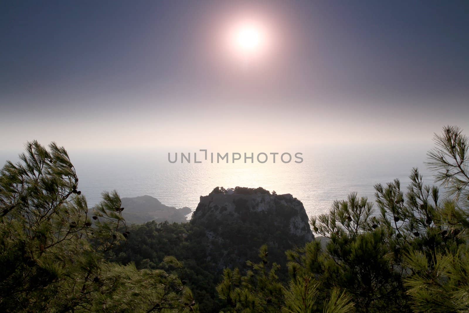 Monolithos Castle sunlight silhouette  by olliemt
