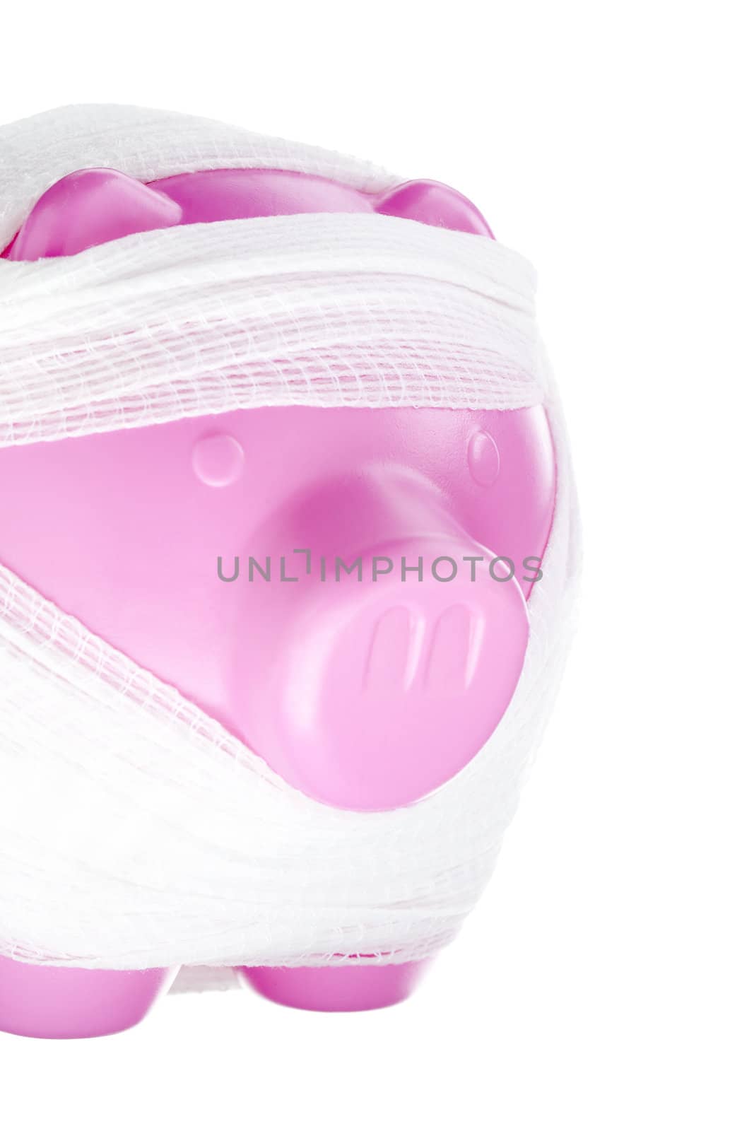 Close-up shot of bandaged piggy bank isolated on white background