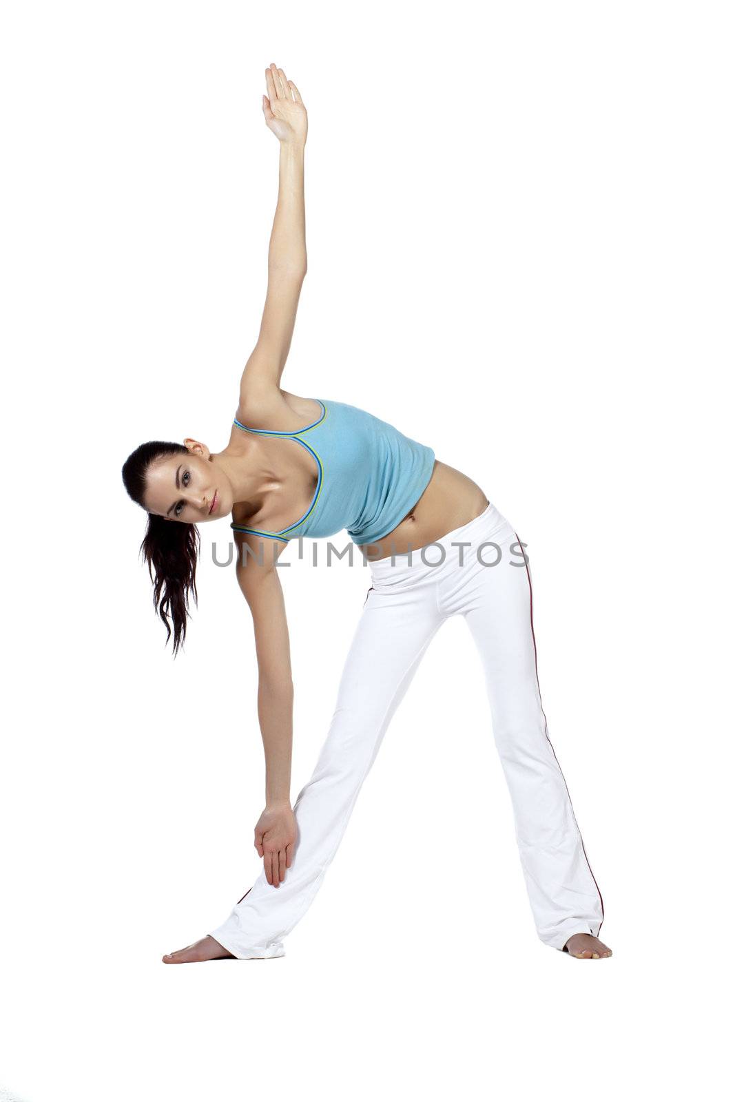 Isolated  image of young woman doing the triangle position in yoga exercise against a white background
