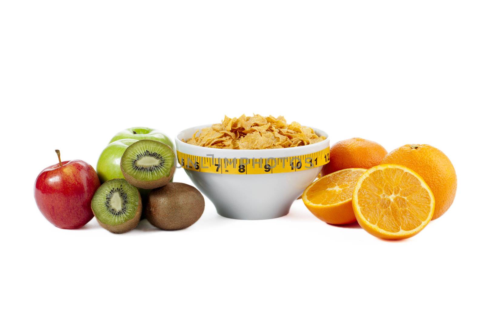 Bowl of cereals together with an apple, kiwi fruit and orange slices