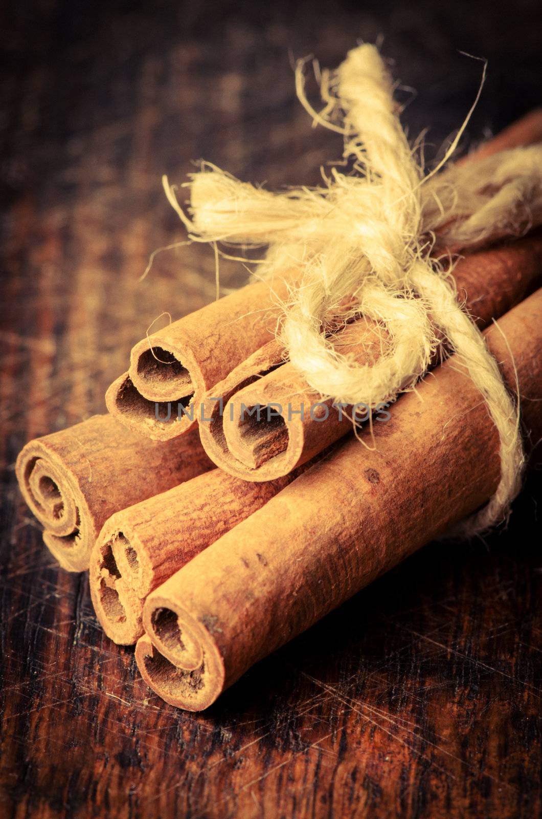 Cinnamon sticks on wooden table studio