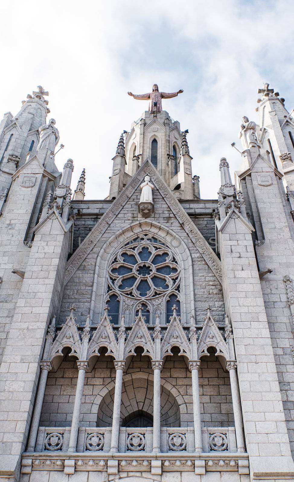 Tibidabo church on mountain in Barcelona with christ statue overviewing the city