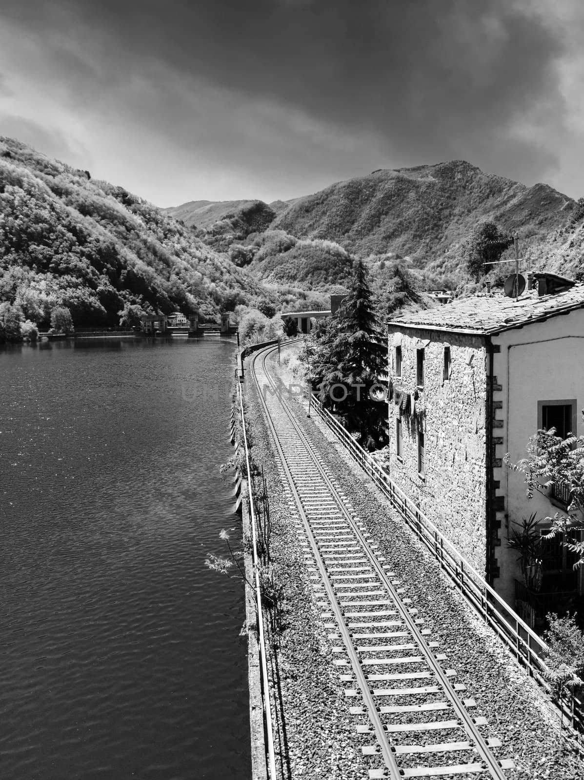 Railway with River, Sky and Vegetation, Tuscany, Italy