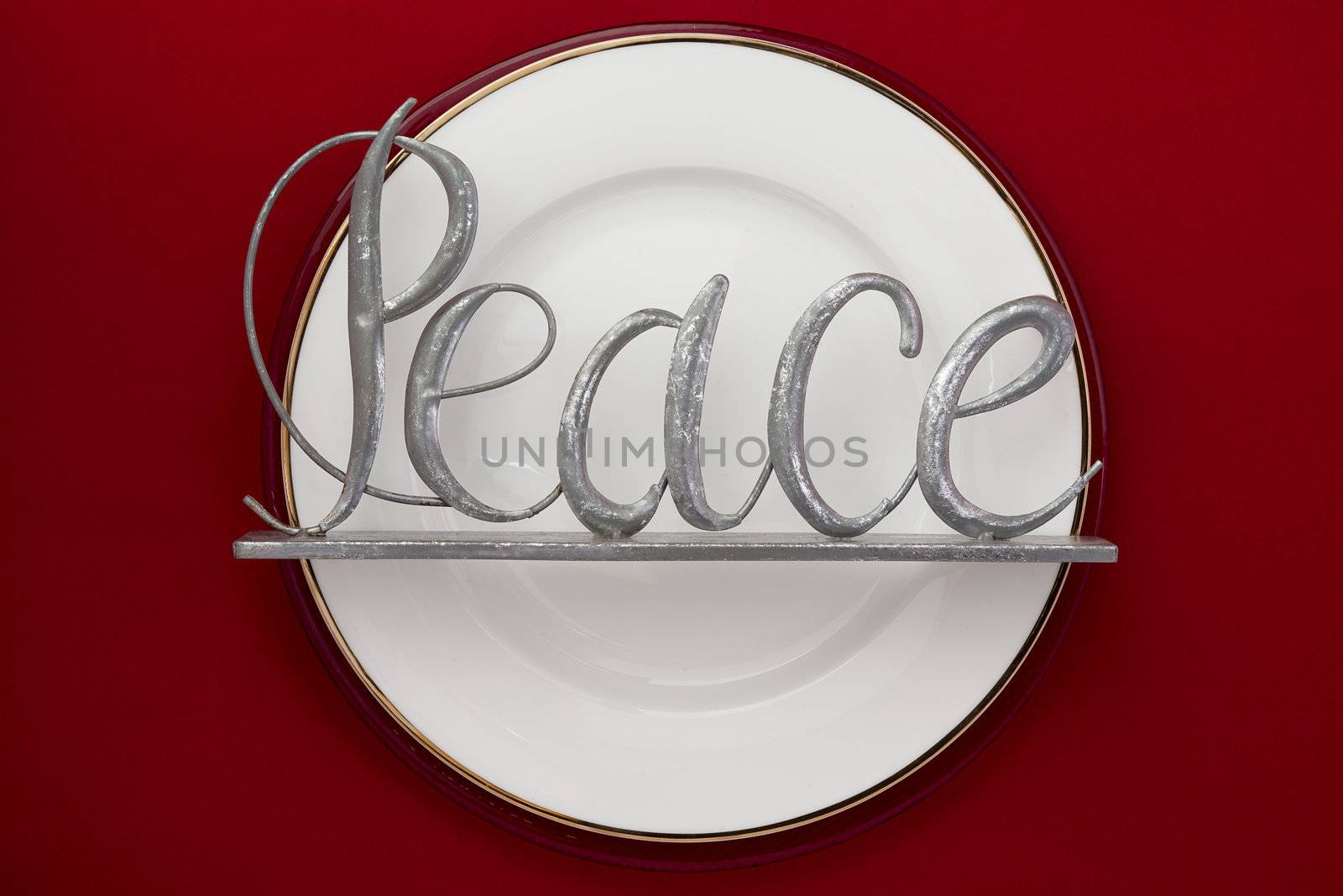 white plate with word peace by kozzi