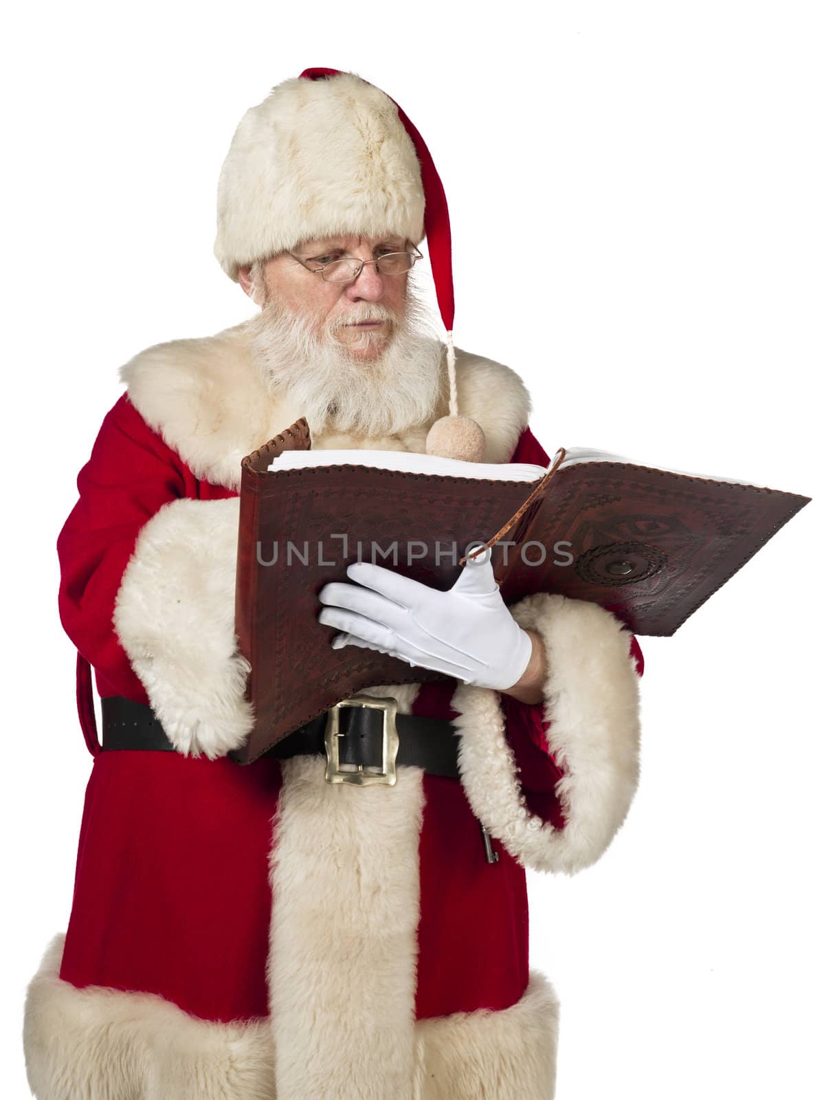 Santa Claus reading a book on white background