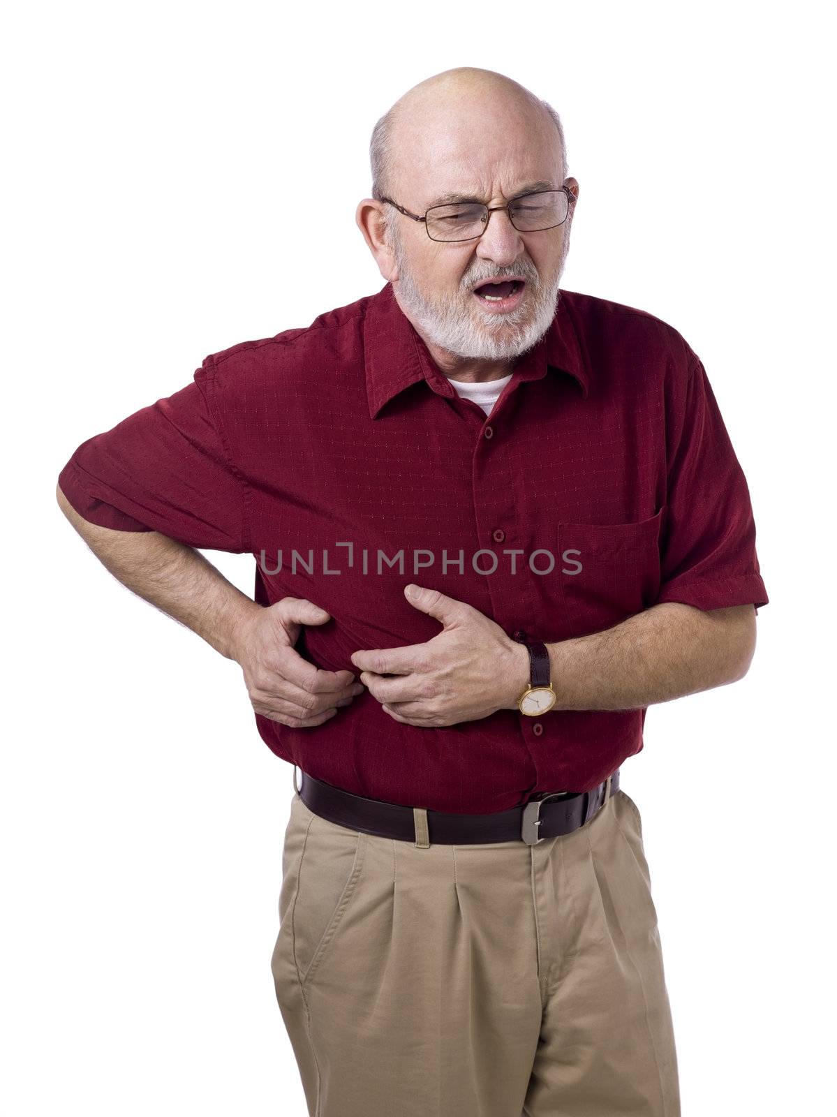 Portrait image of an old man suffering with stomach ache against white background