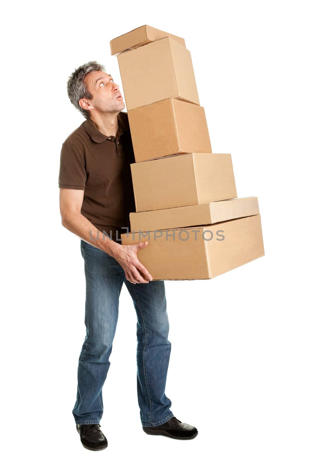 Delivery man balancing stack of boxes. Isolated on white