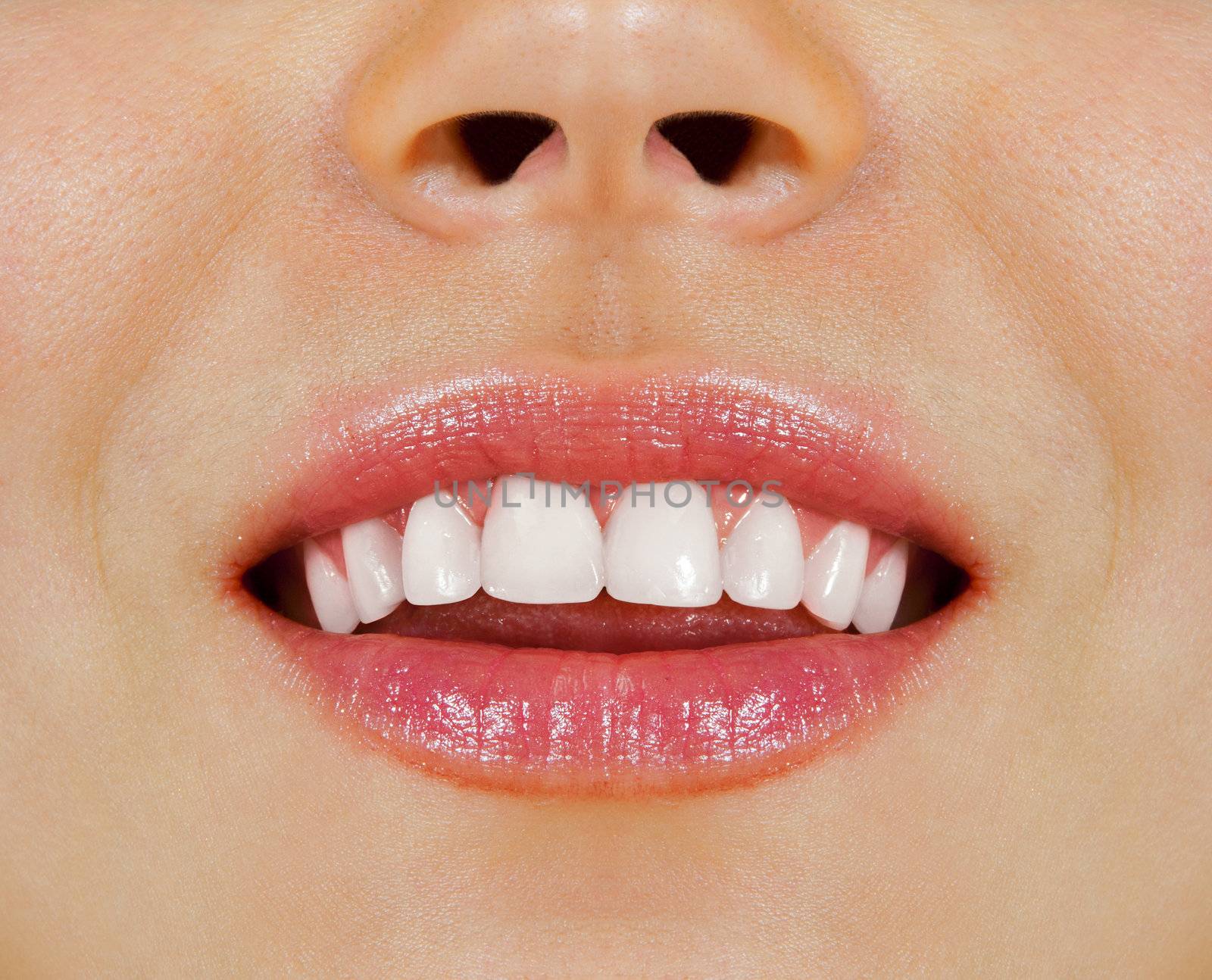 Healthy woman teeth and smile. Close up.