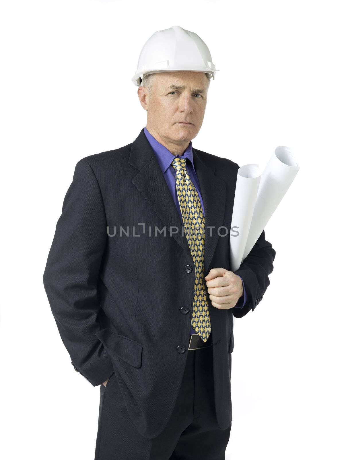 Portrait shot of an old architect wearing hard hat and holding a blueprint paper. Model: Brian Hayden