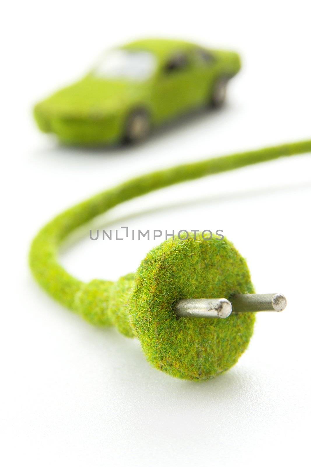 green electric plug with eco car icon by ponsulak