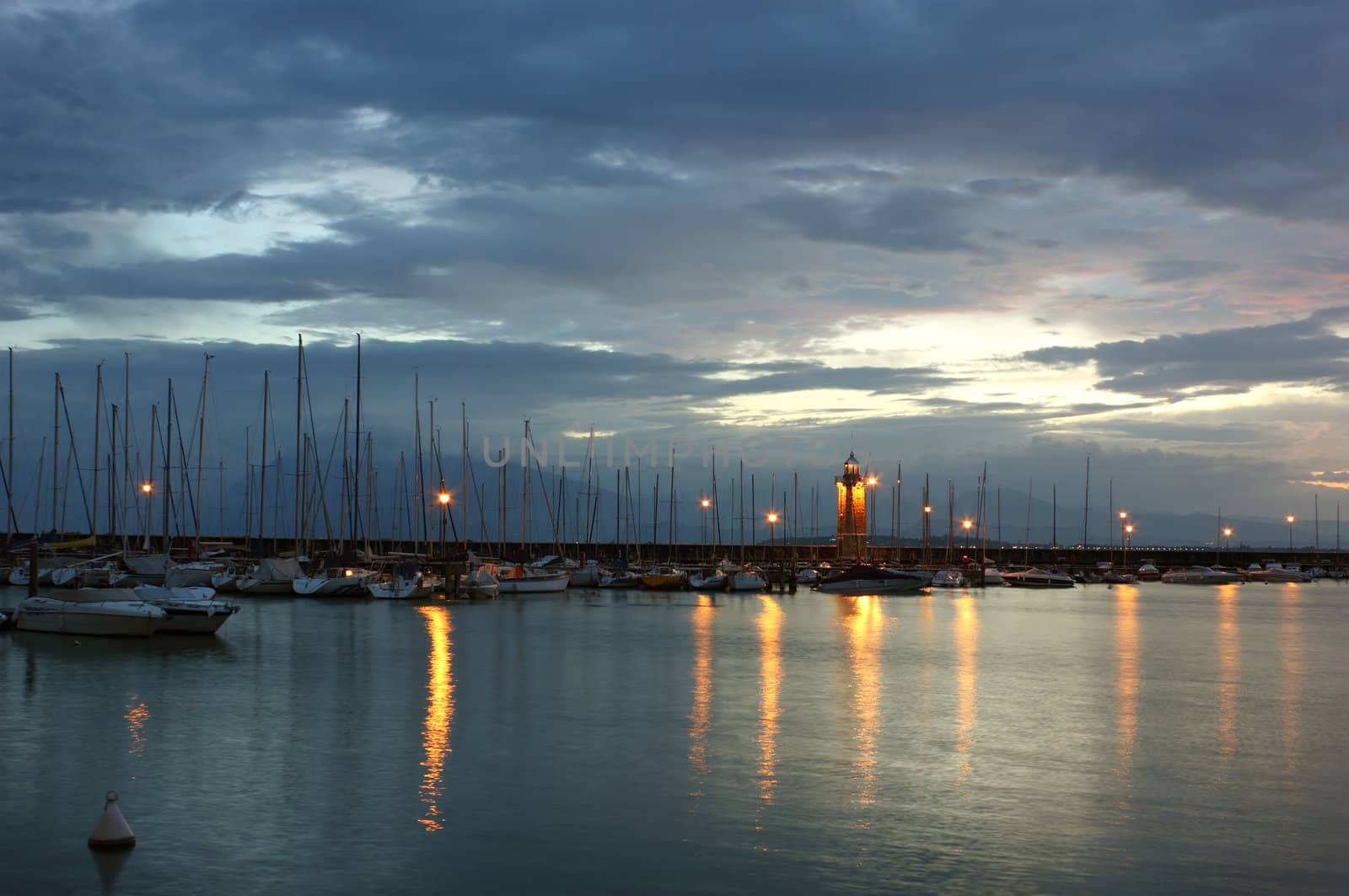Just before the sunrise at Desenzano del Garda with the Marina and the old lighthouse.