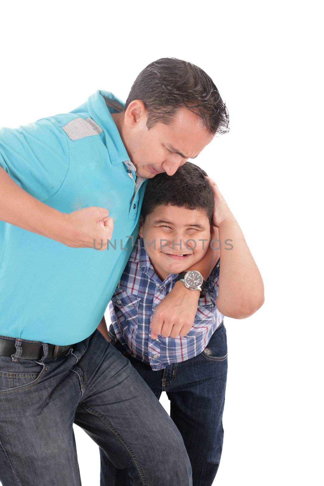 Young boy being aggressively held up by his father by dacasdo