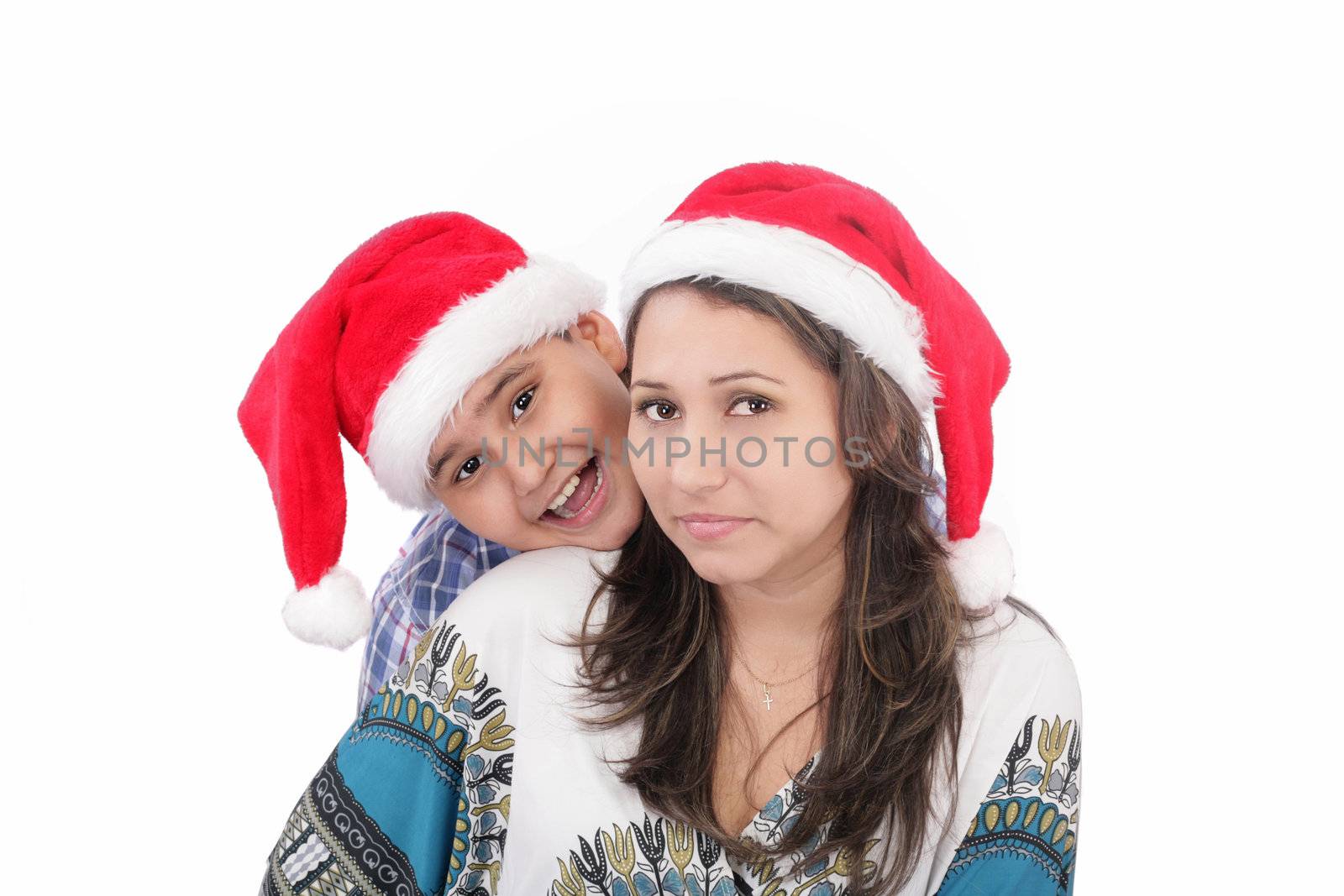 Cheerful boy and woman in Santa Claus hat. Isolated on white bac by dacasdo