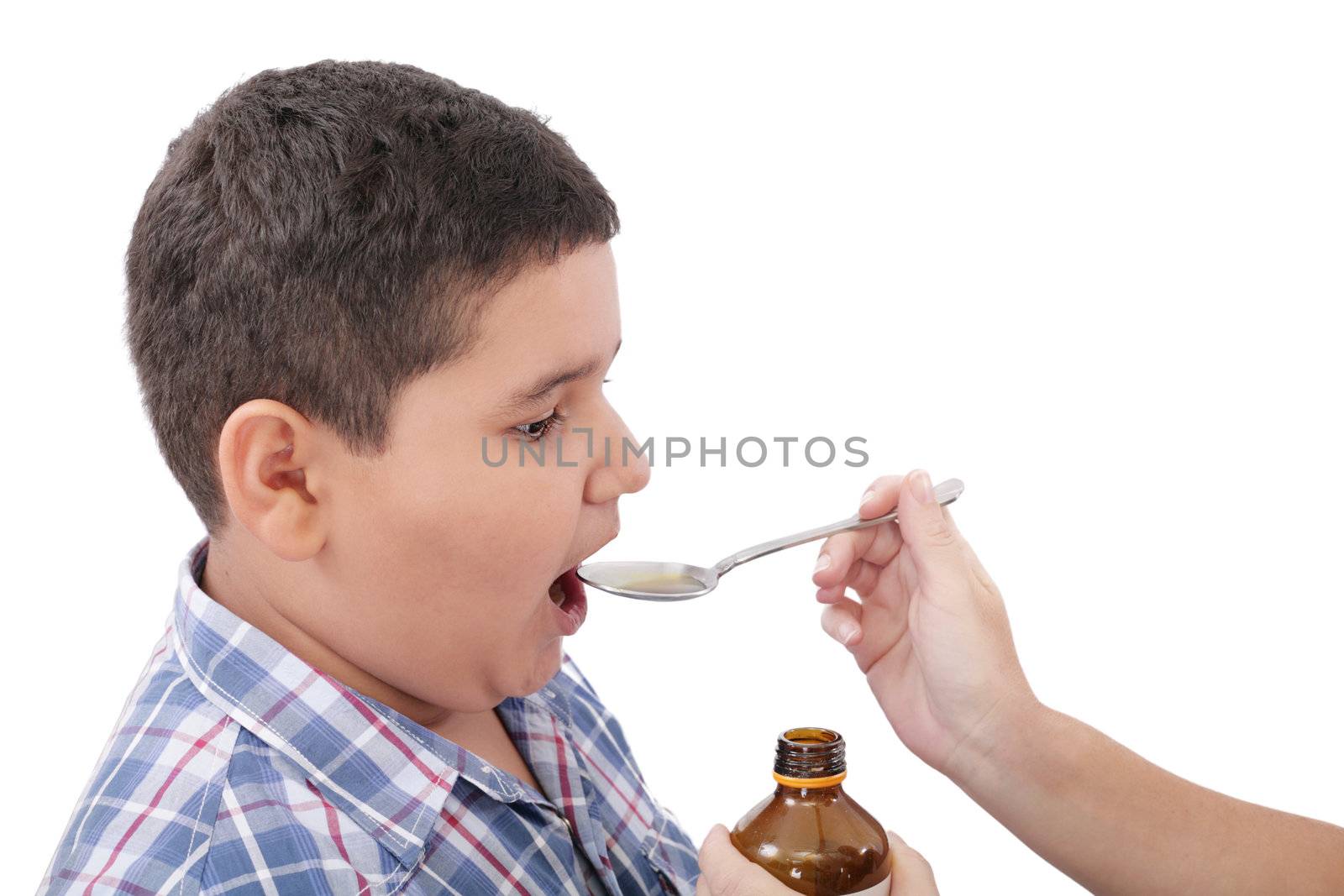 Child taking cough medicine because of the flu