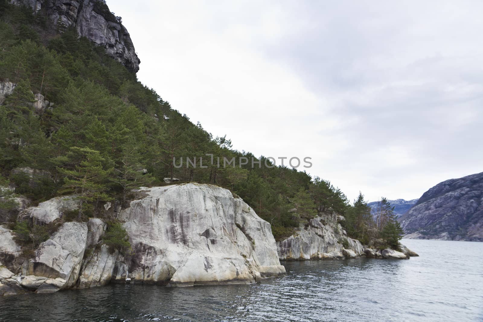 steep rock at coast in norway - horizontal image