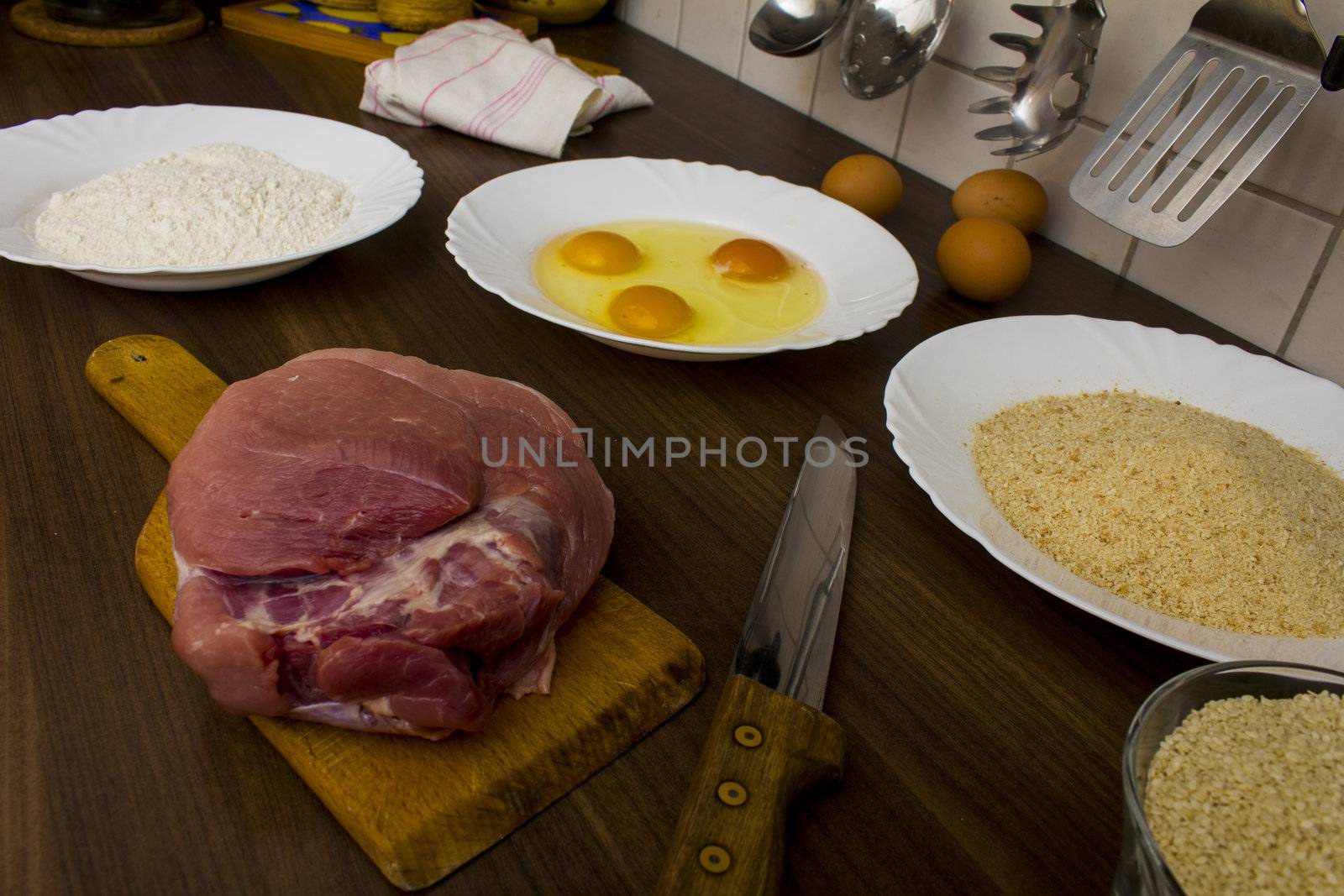 preparations for cooking schnitzel in the kitchen