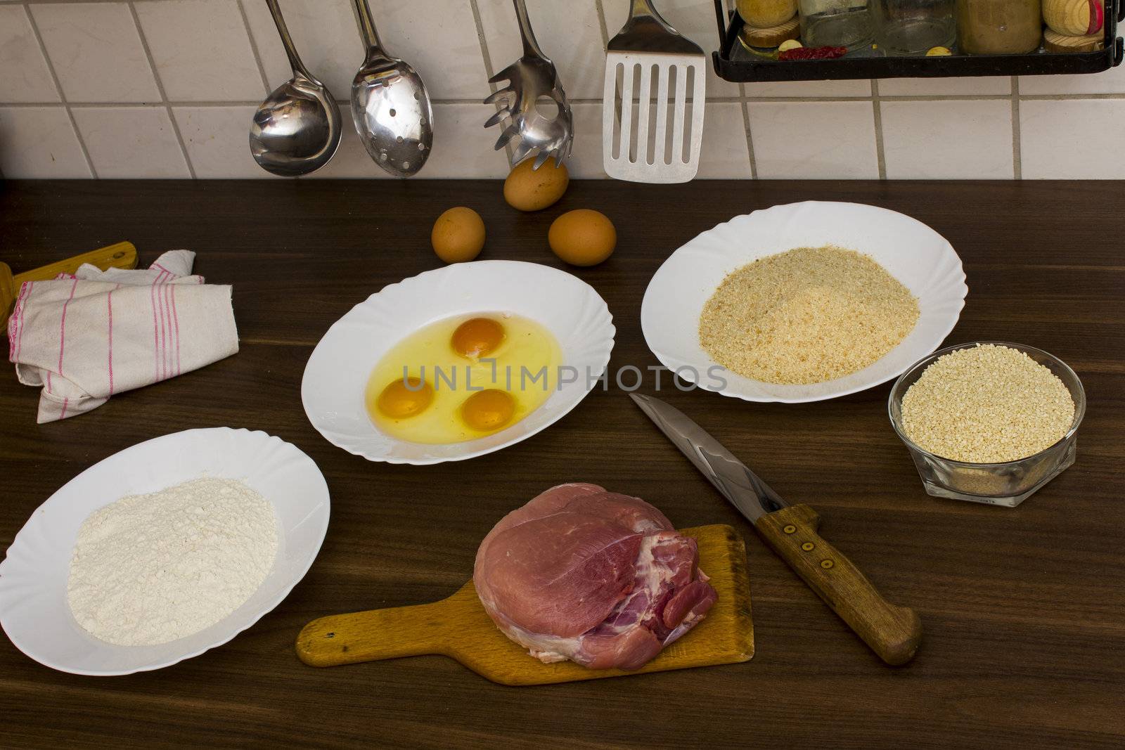 preparations for cooking schnitzel in the kitchen