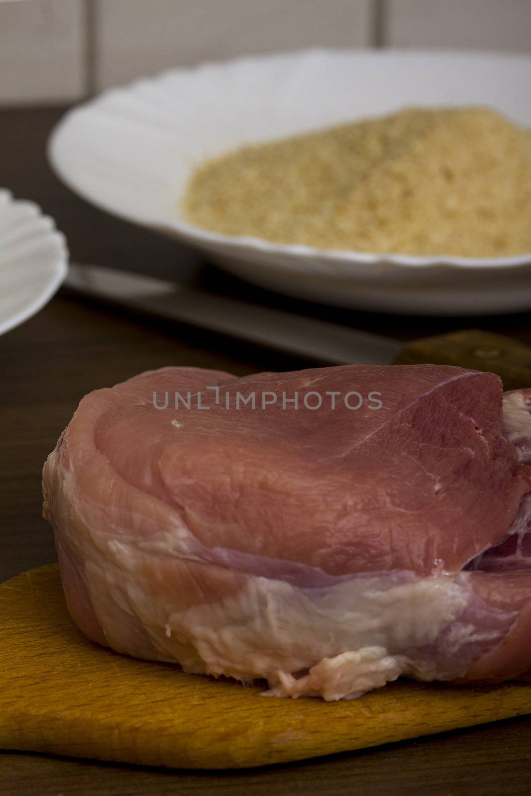 preparations for cooking schnitzel in the kitchen