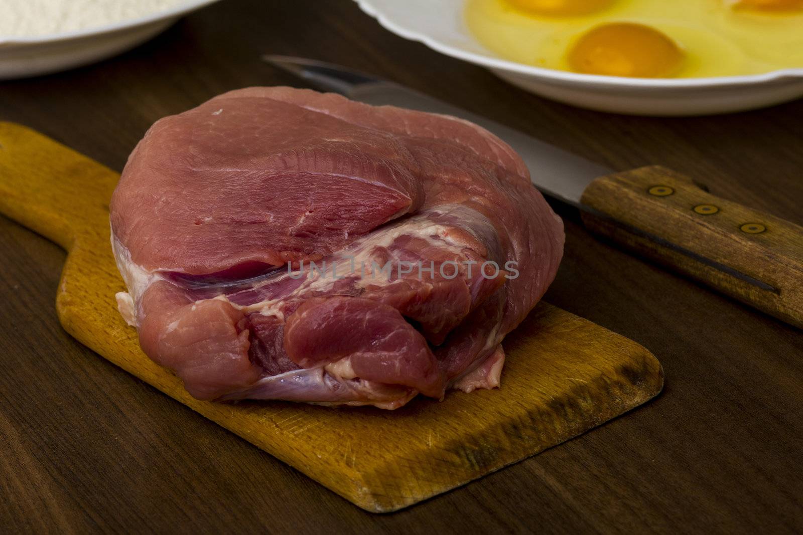 preparations for cooking schnitzel in the kitchen