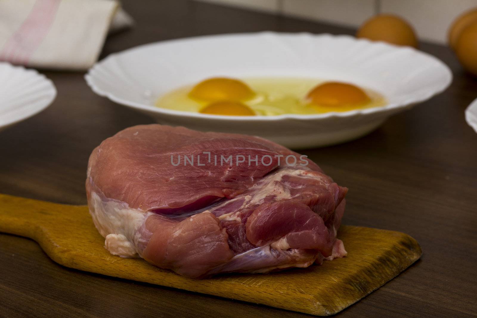 preparations for cooking schnitzel in the kitchen