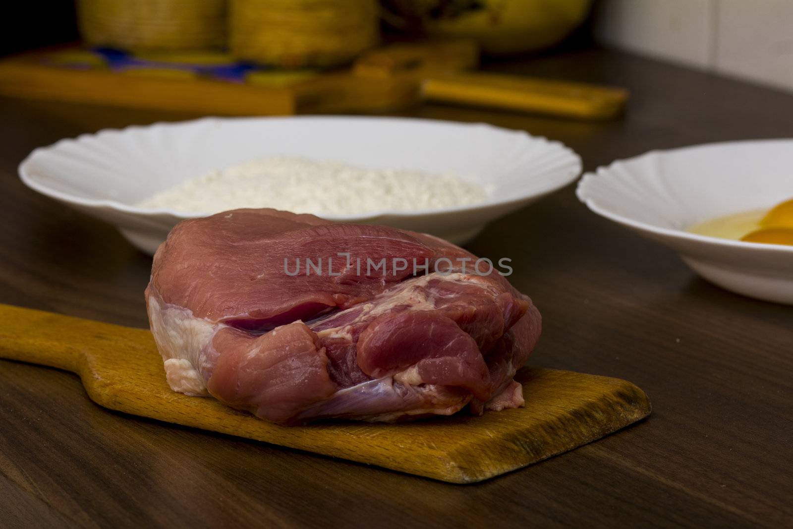 preparations for cooking schnitzel in the kitchen