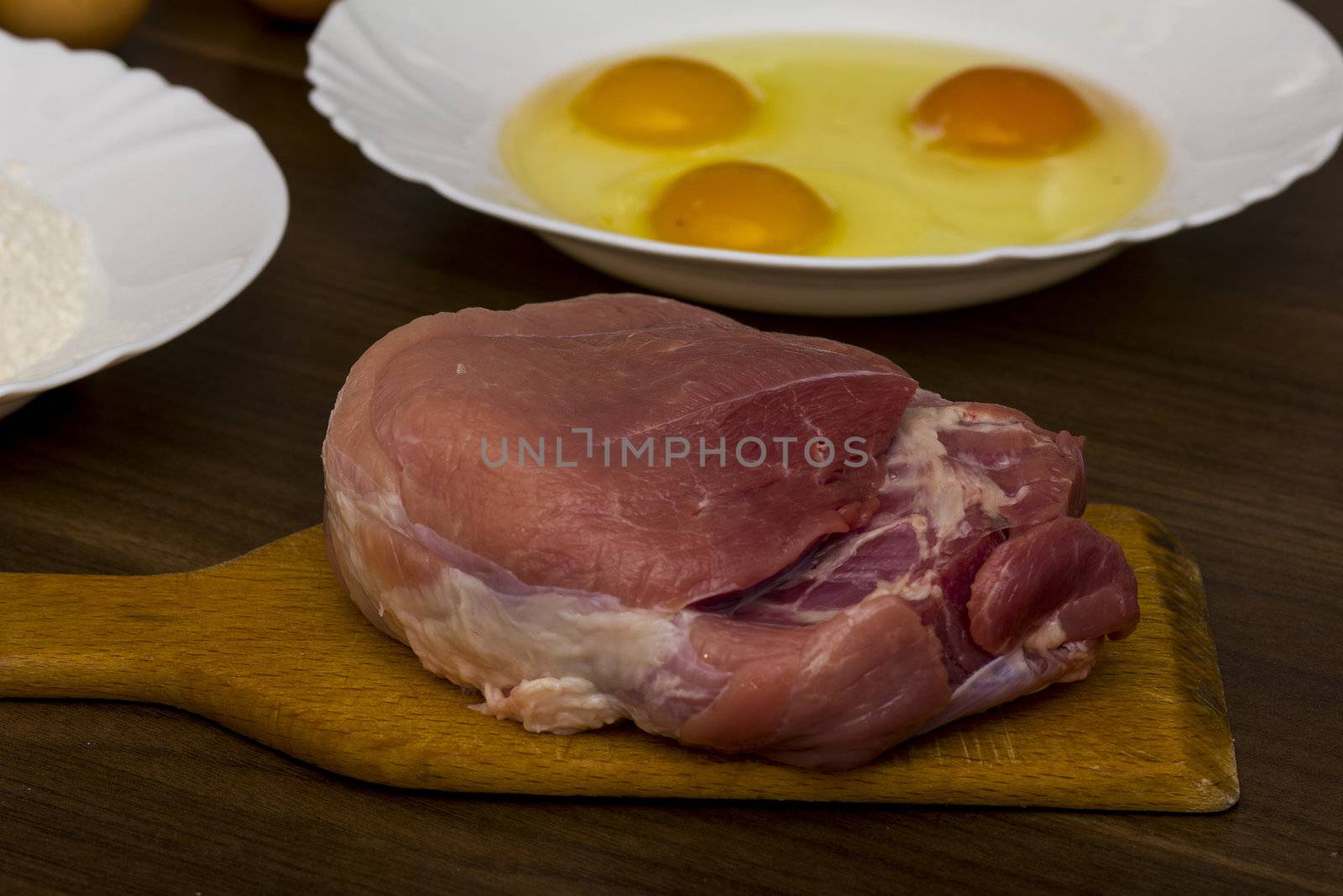 preparations for cooking schnitzel in the kitchen