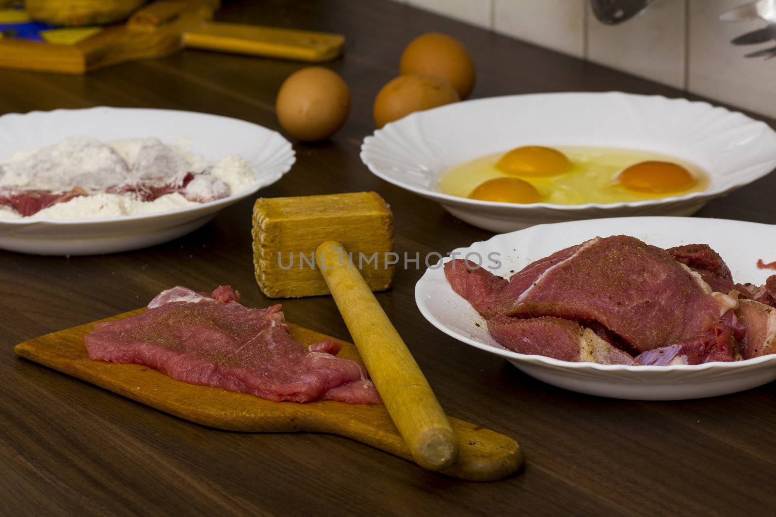 preparations for cooking schnitzel in the kitchen