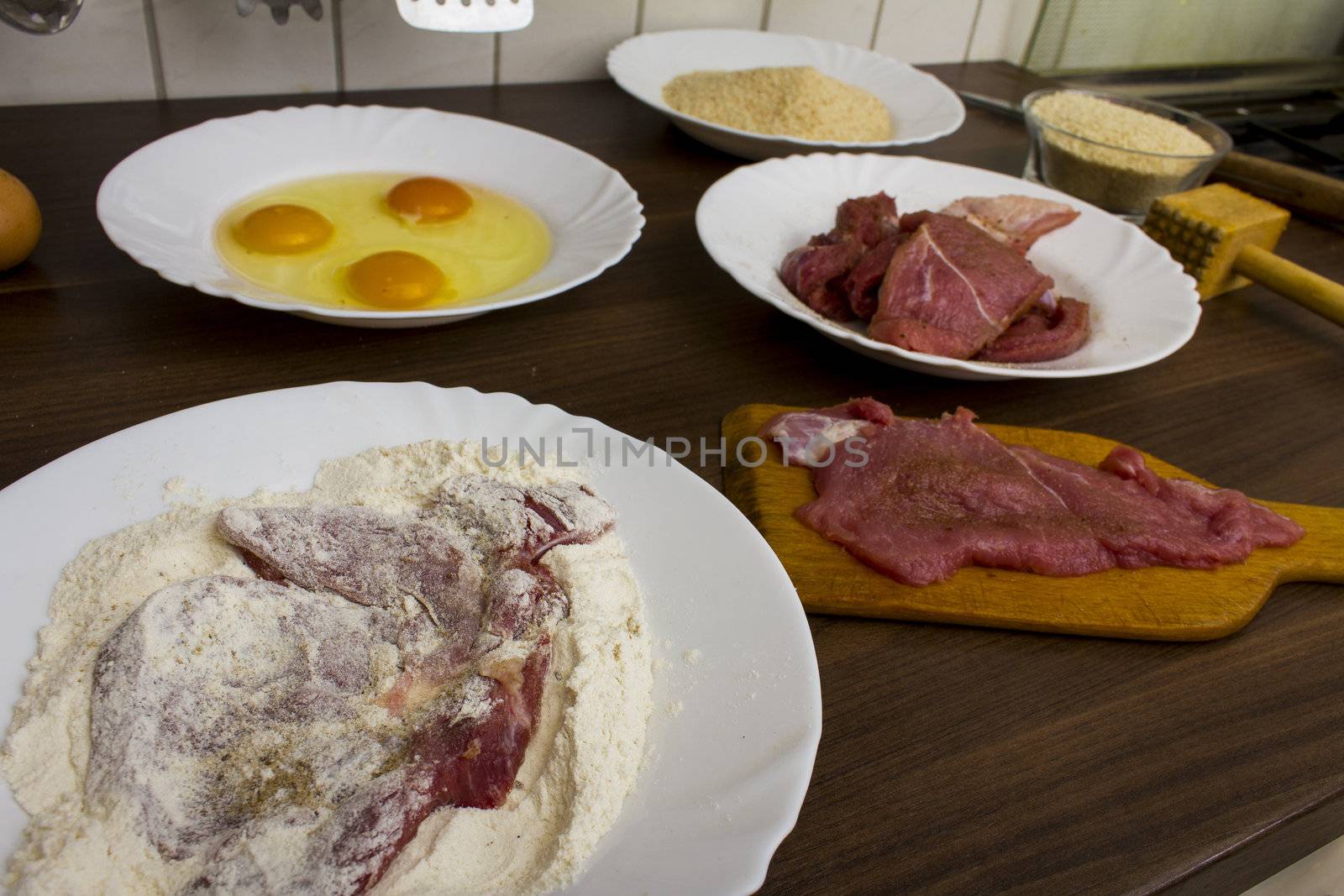 preparations for cooking schnitzel in the kitchen