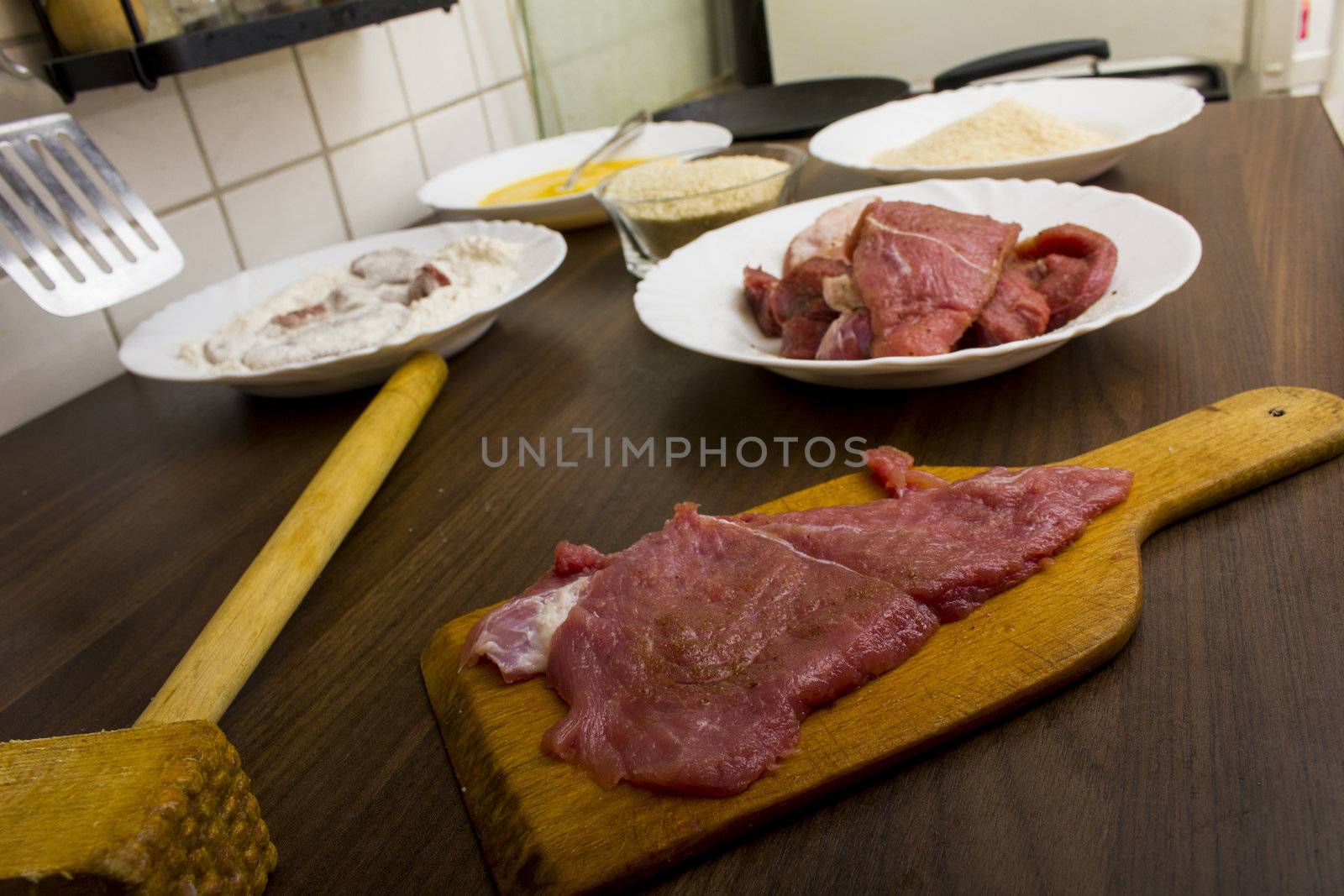 preparations for cooking schnitzel in the kitchen