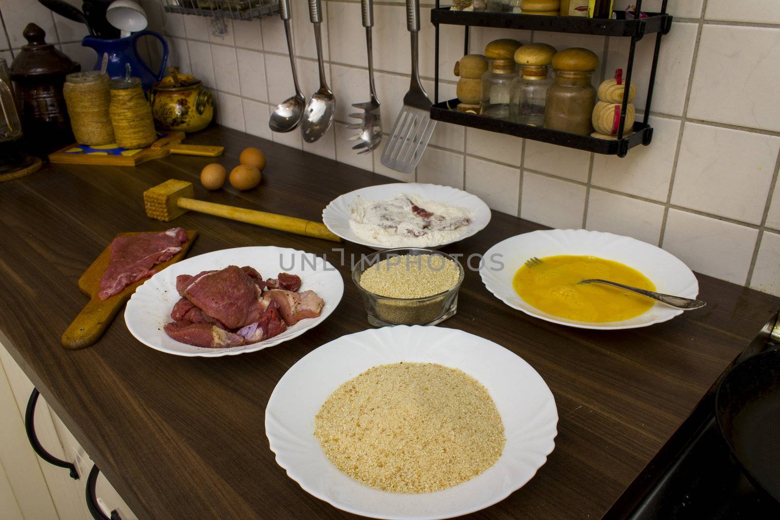 preparations for cooking schnitzel in the kitchen
