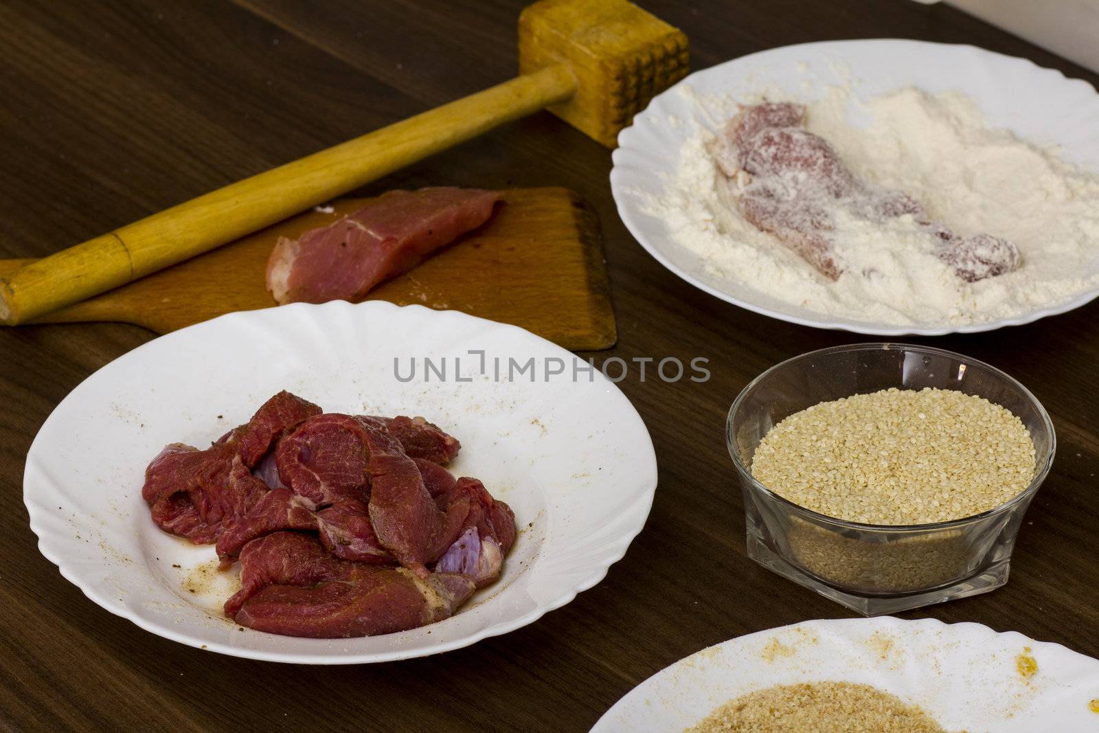 preparations for cooking schnitzel in the kitchen
