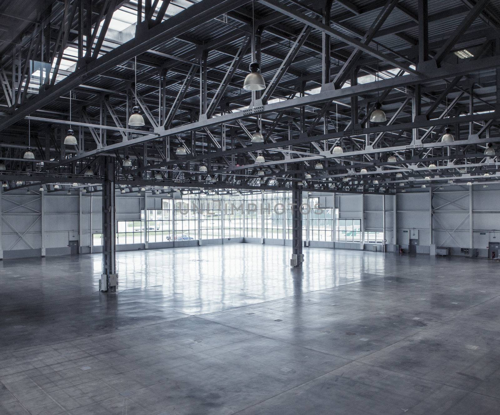 Interior of an empty warehouse with glass wall