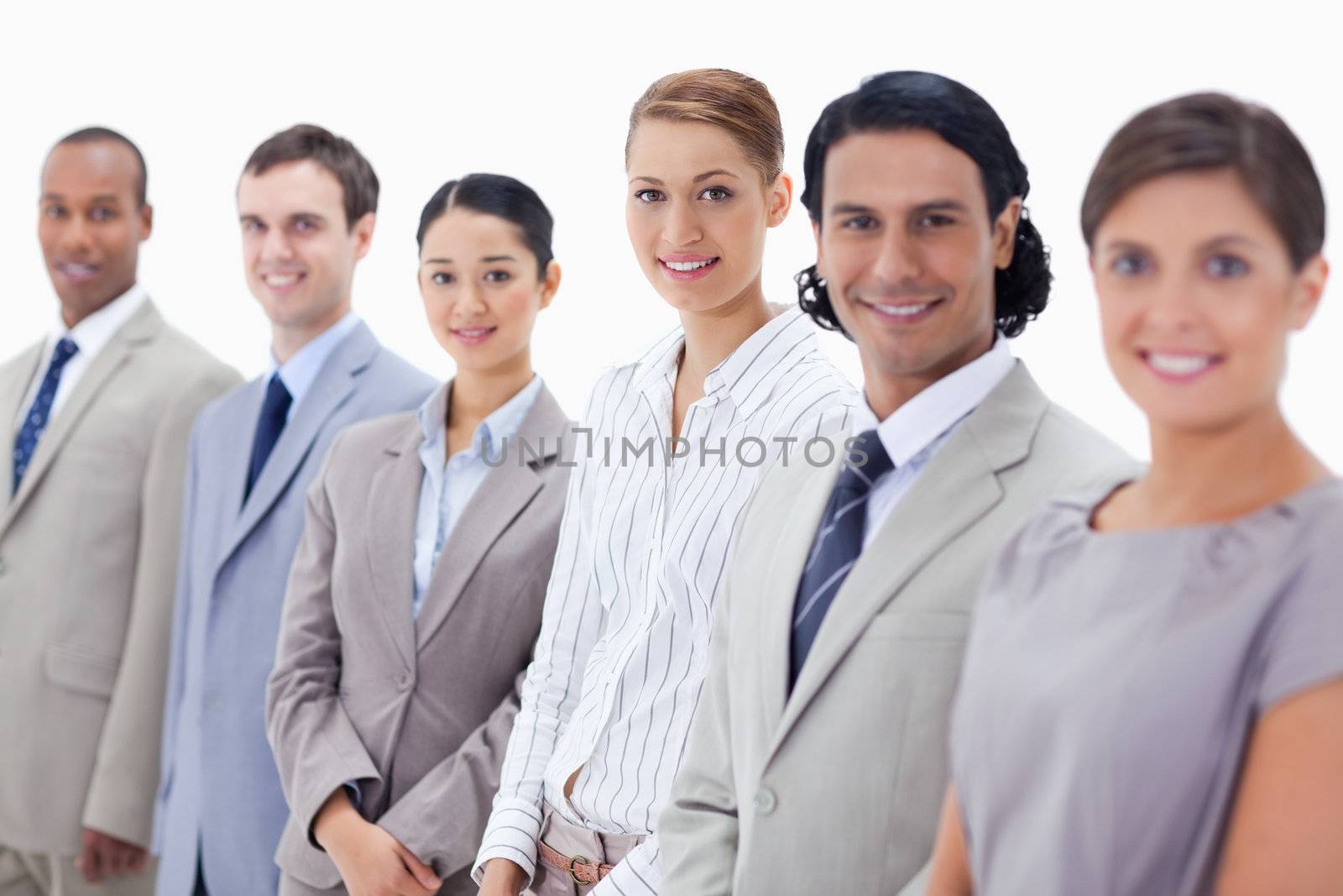 Close-up of smiling business people looking straight by Wavebreakmedia