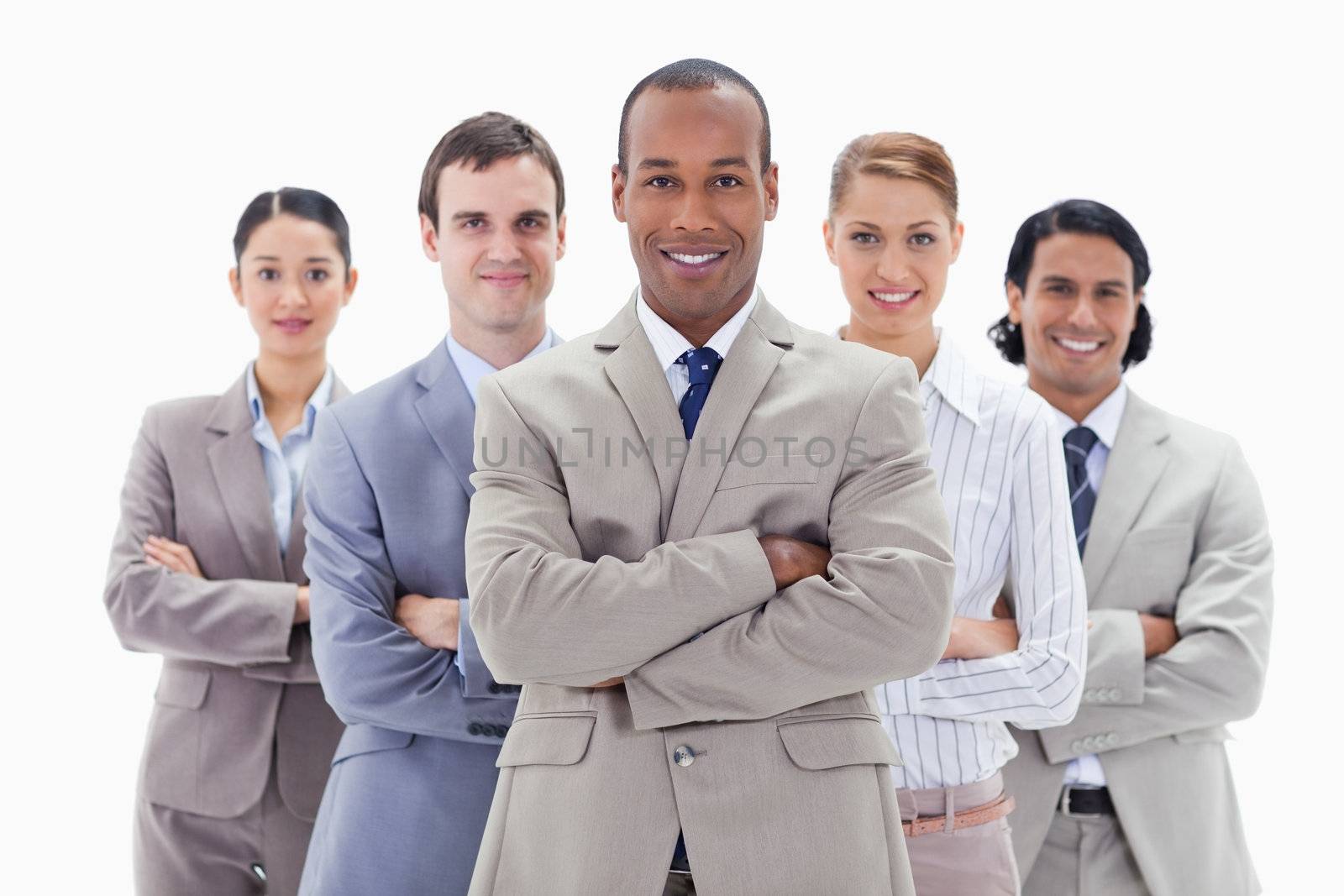 Close-up of a business team smiling and crossing their arms by Wavebreakmedia
