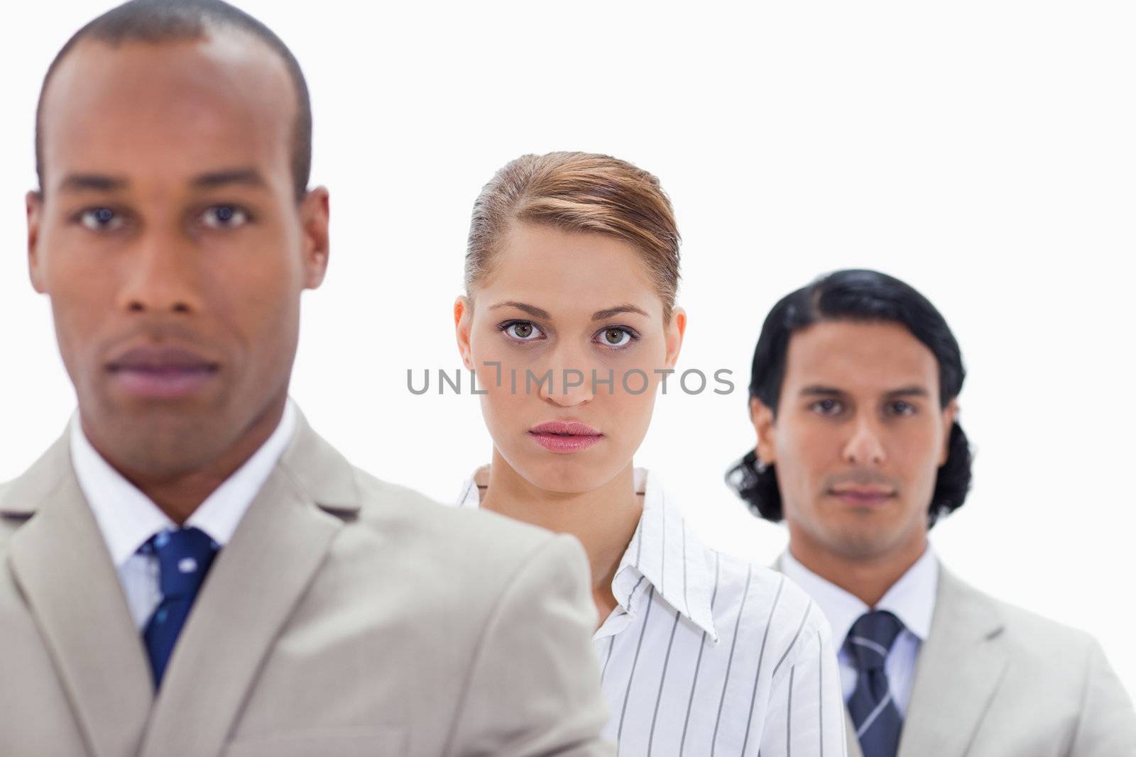 Big close-up of a serious business team in a single line by Wavebreakmedia