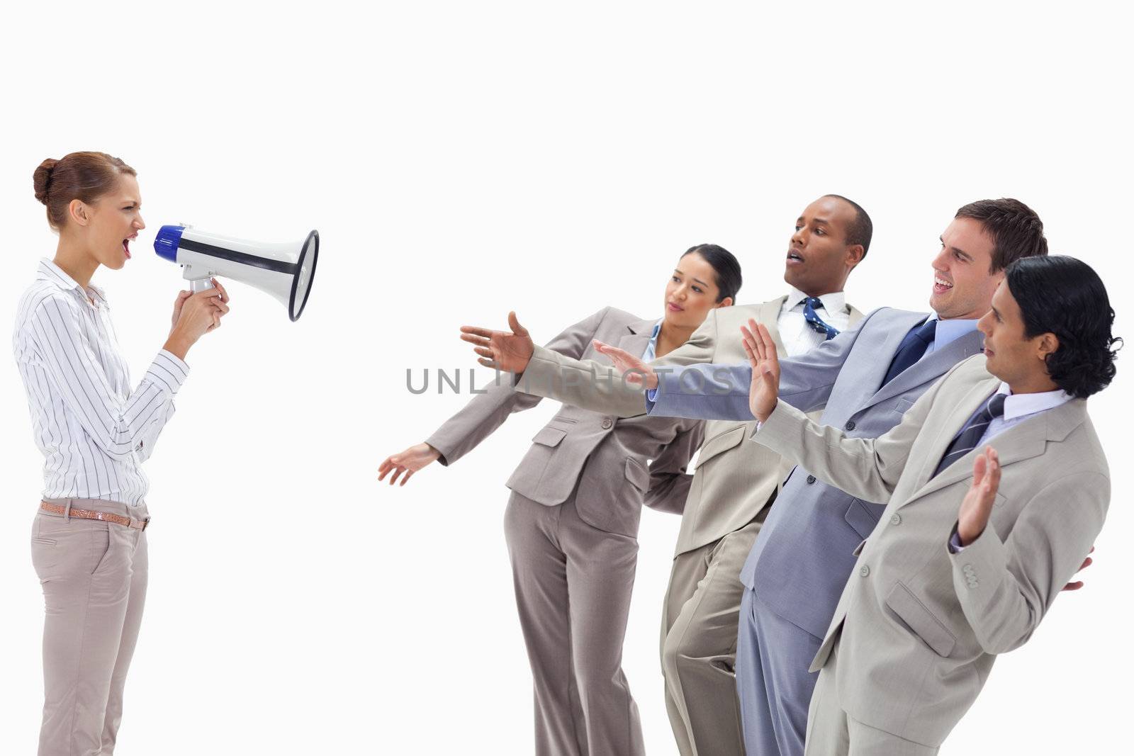 Woman yelling at co-workers through a megaphone by Wavebreakmedia