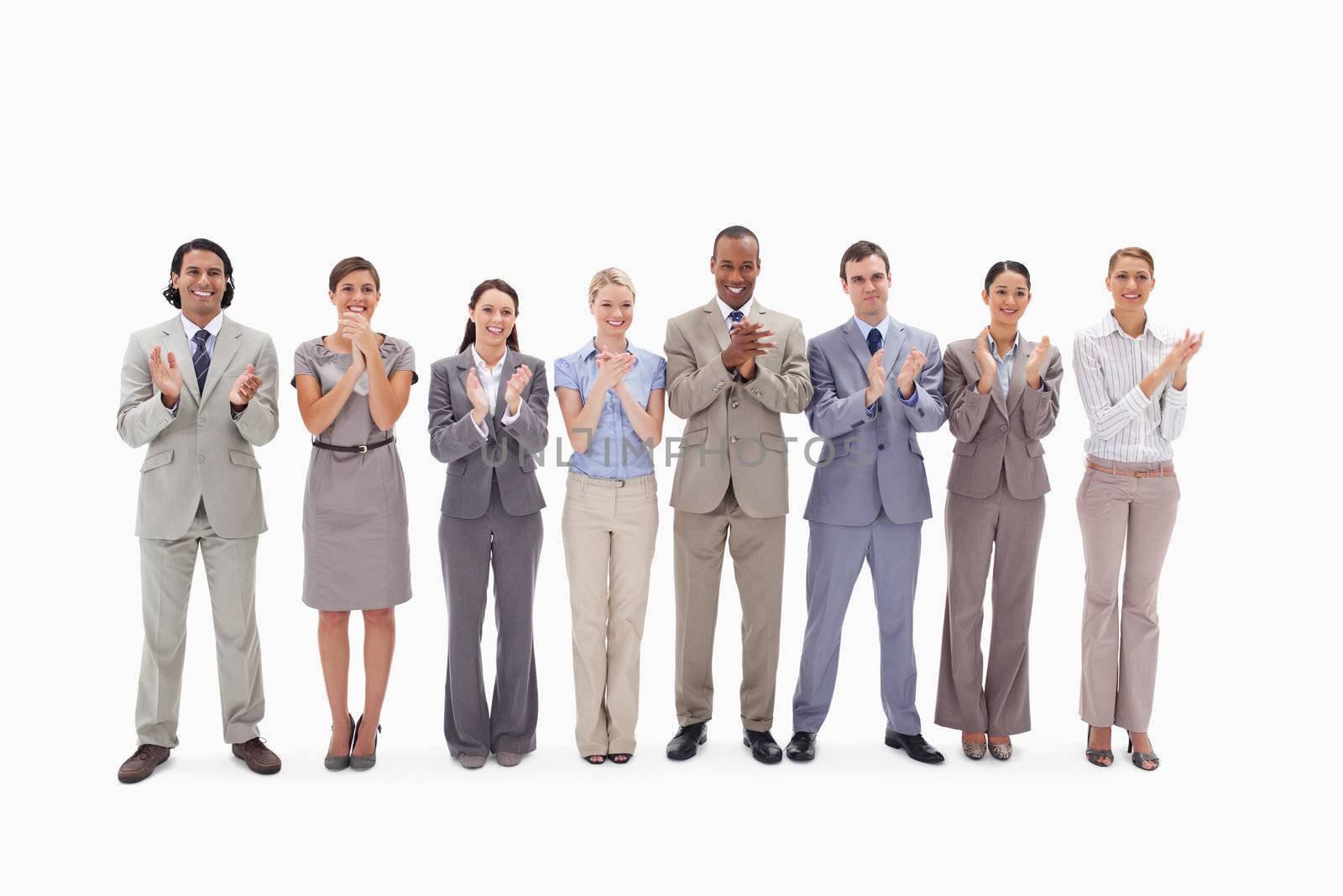 Business team applauding against white background