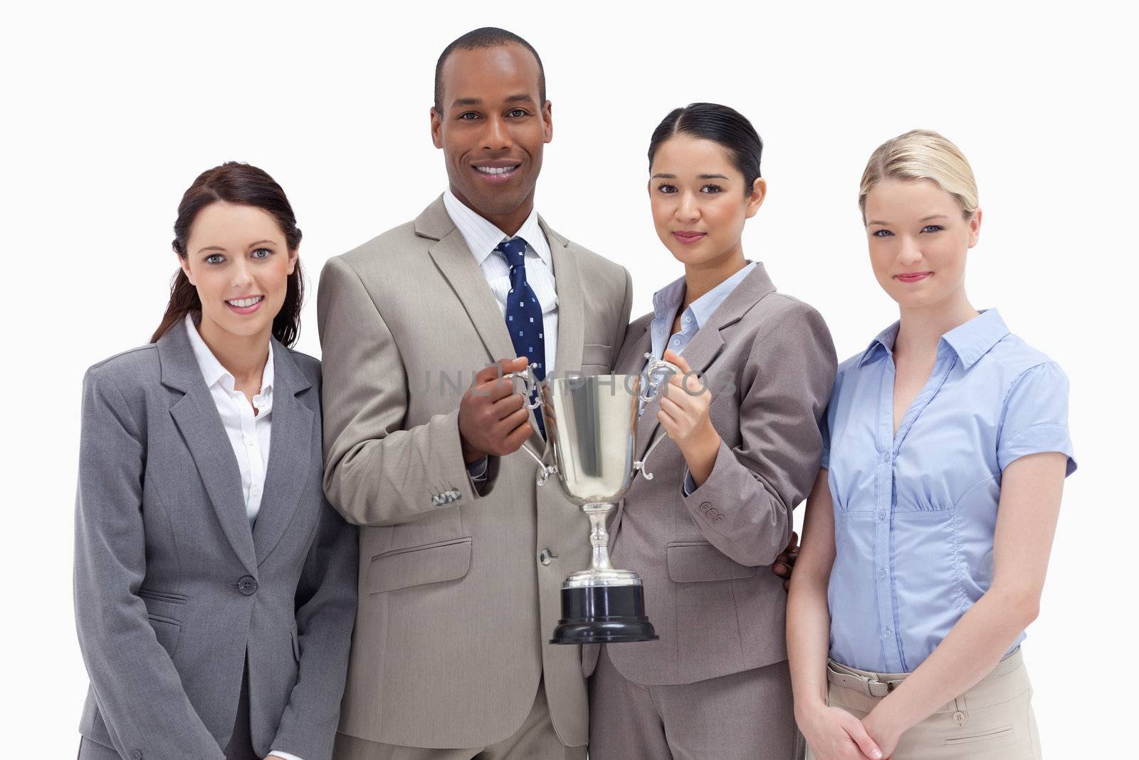 Close-up of a business team holding a cup against white background