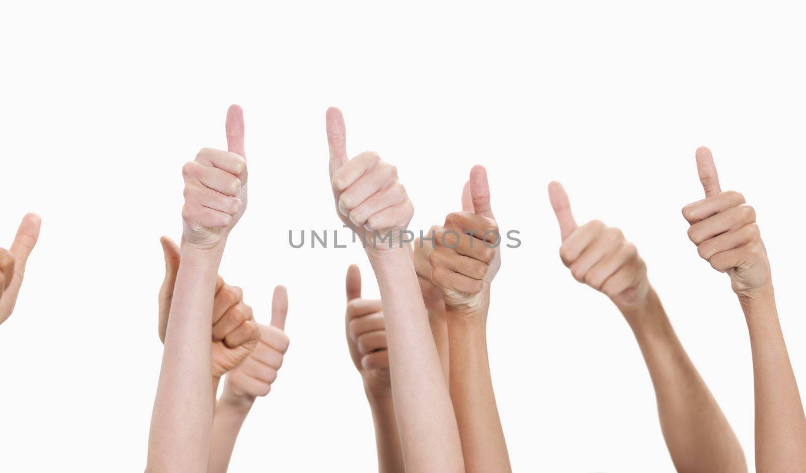 Thumbs raised and hands up against white background